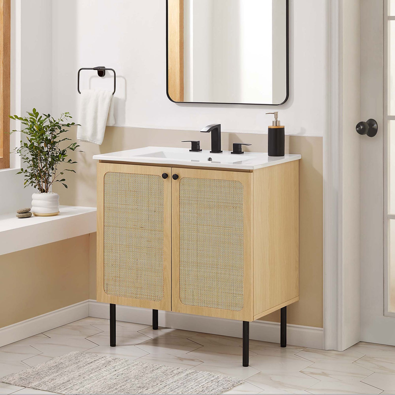 Modern vanity completes the bath with rattan doors and a bright ceramic sink || EEI-6695-OAK-WHI || front_room