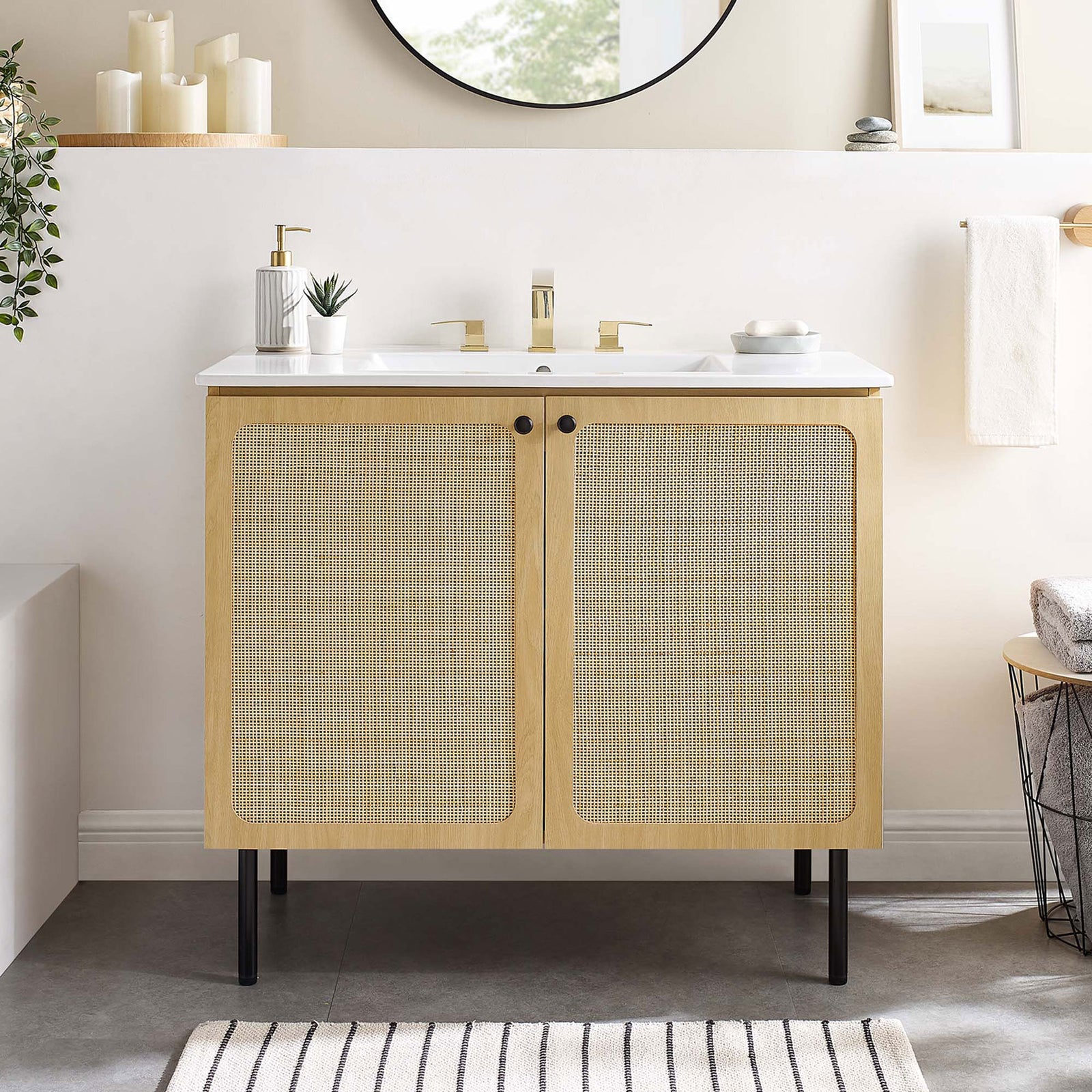 Airy, coastal-inspired vanity anchors the bathroom with rattan doors and white ceramic sink || EEI-6697-OAK-WHI || front_room