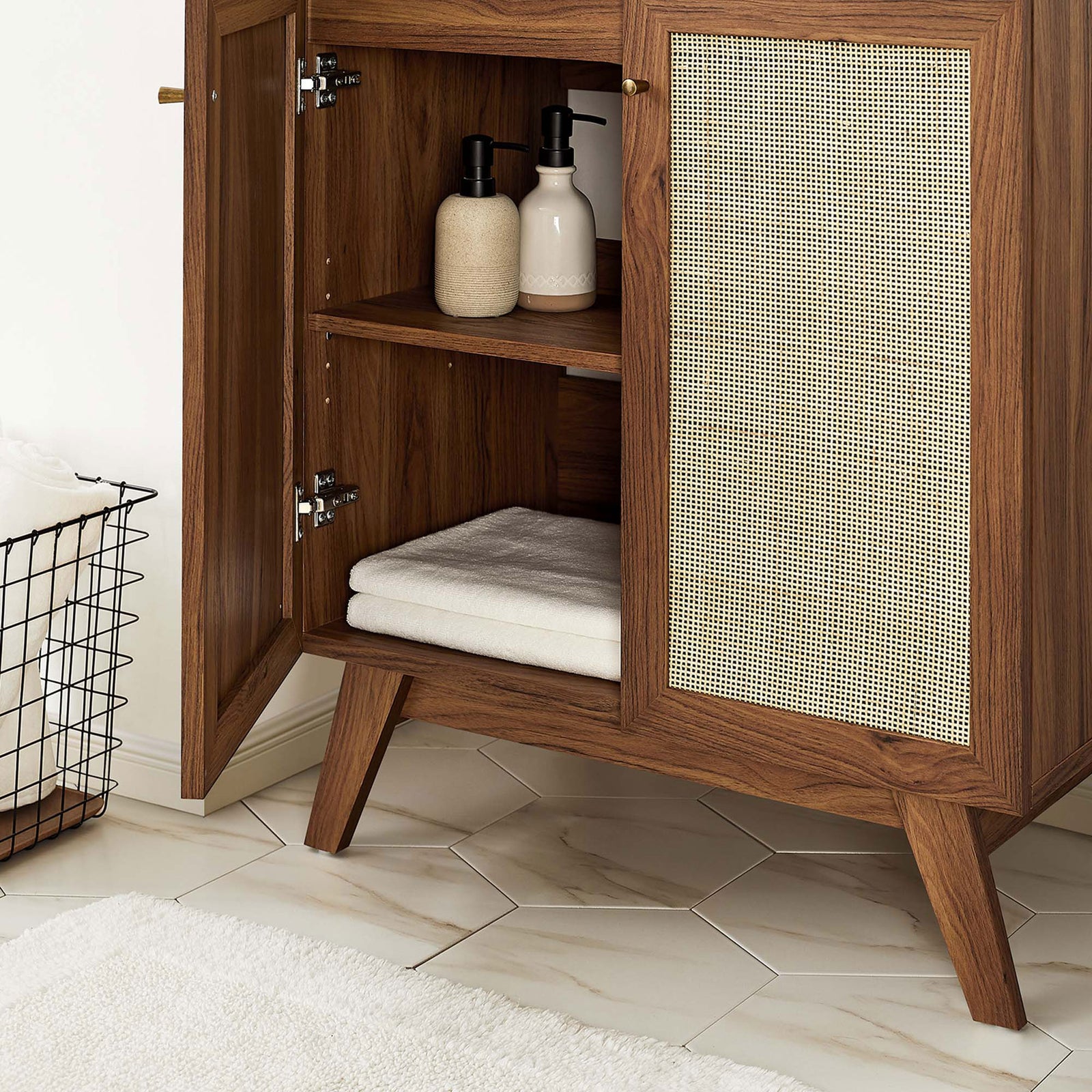 Open shelving inside keeps towels and toiletries neatly organized behind the cane doors. || EEI-6716-WAL-BLK || storage_open_room