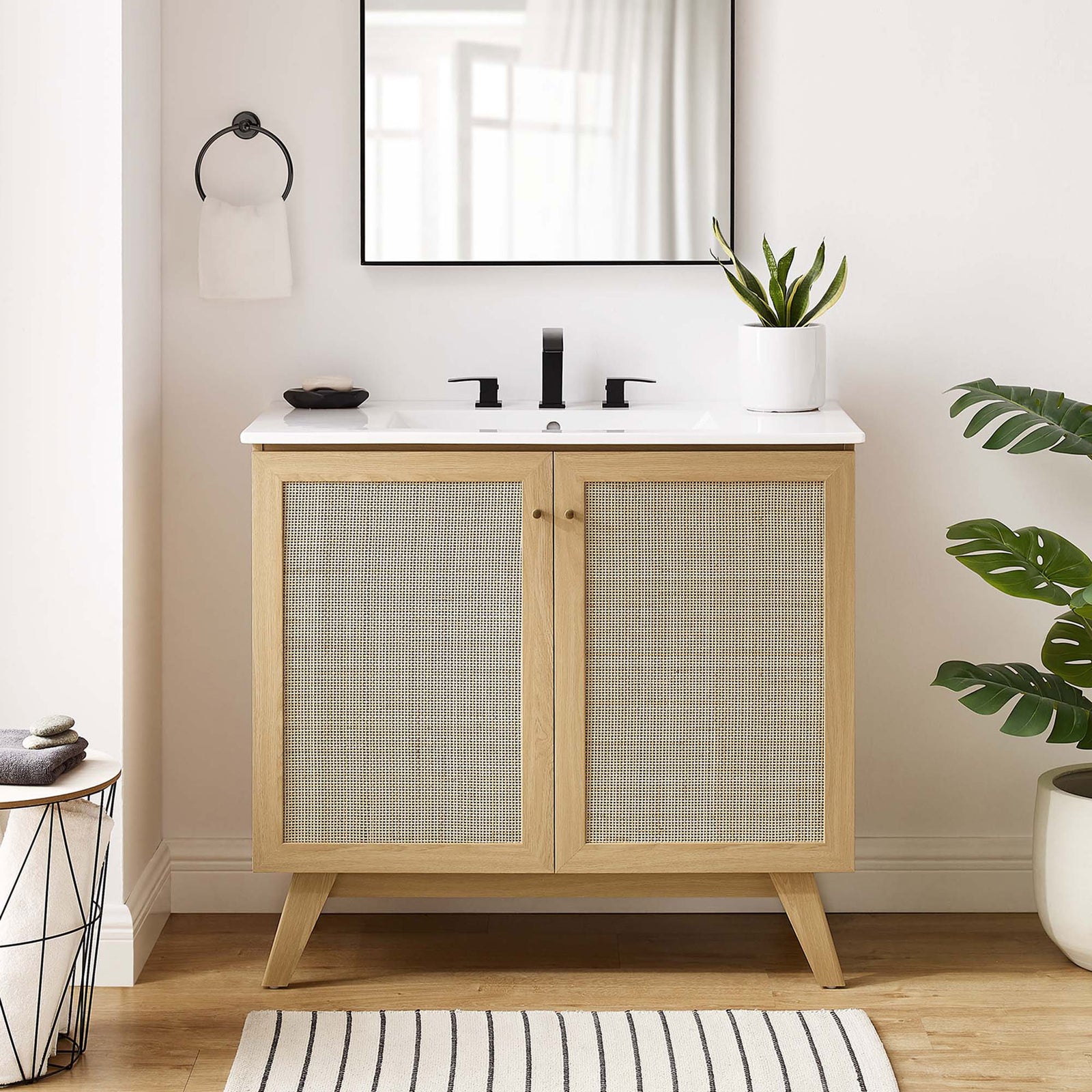 Light oak and cane create a calming focal point in the bathroom. || EEI-6717-OAK-WHI || front_room