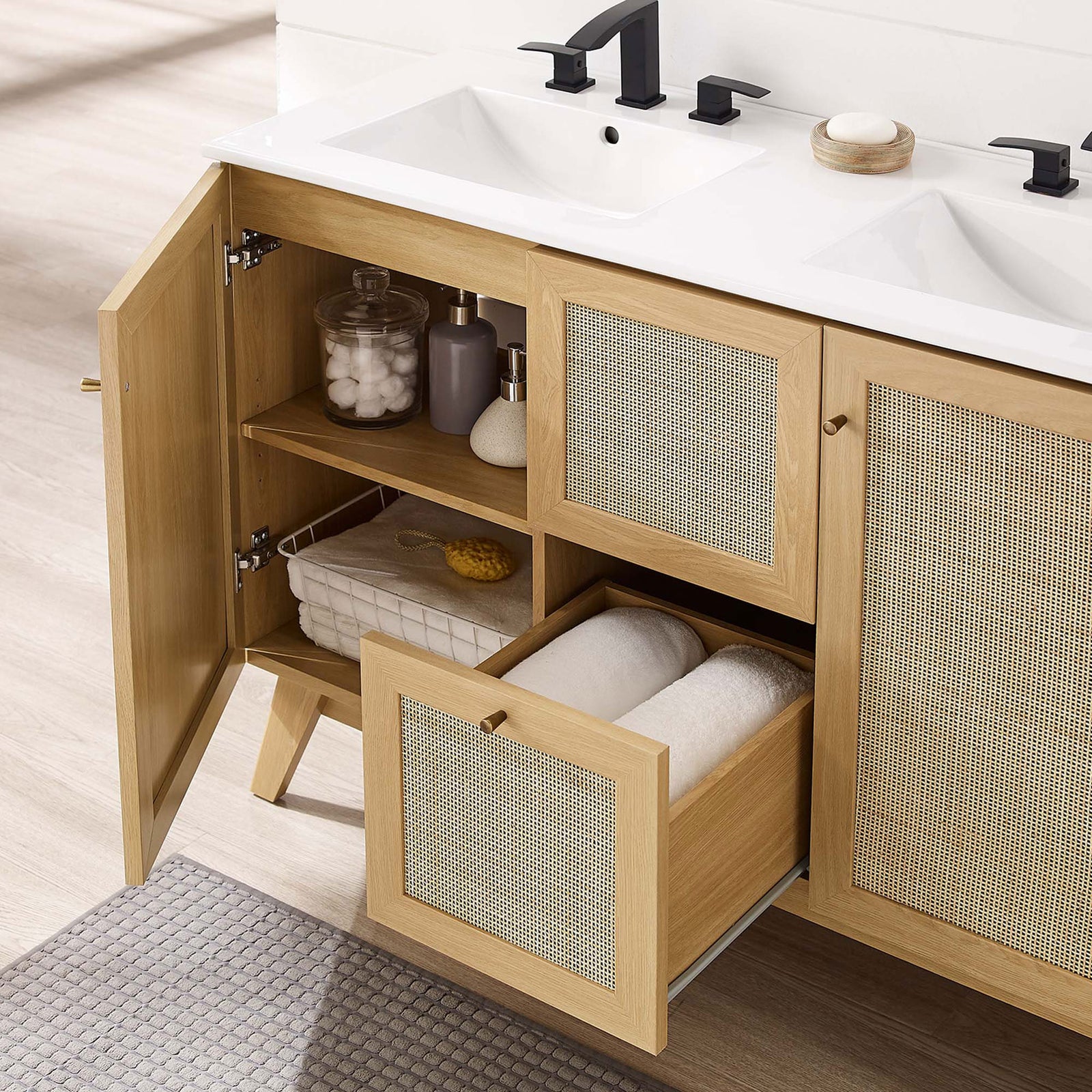 Cabinet doors and drawer open to reveal adjustable storage beneath twin sinks || EEI-6721-OAK-WHI || front_angle_open_room