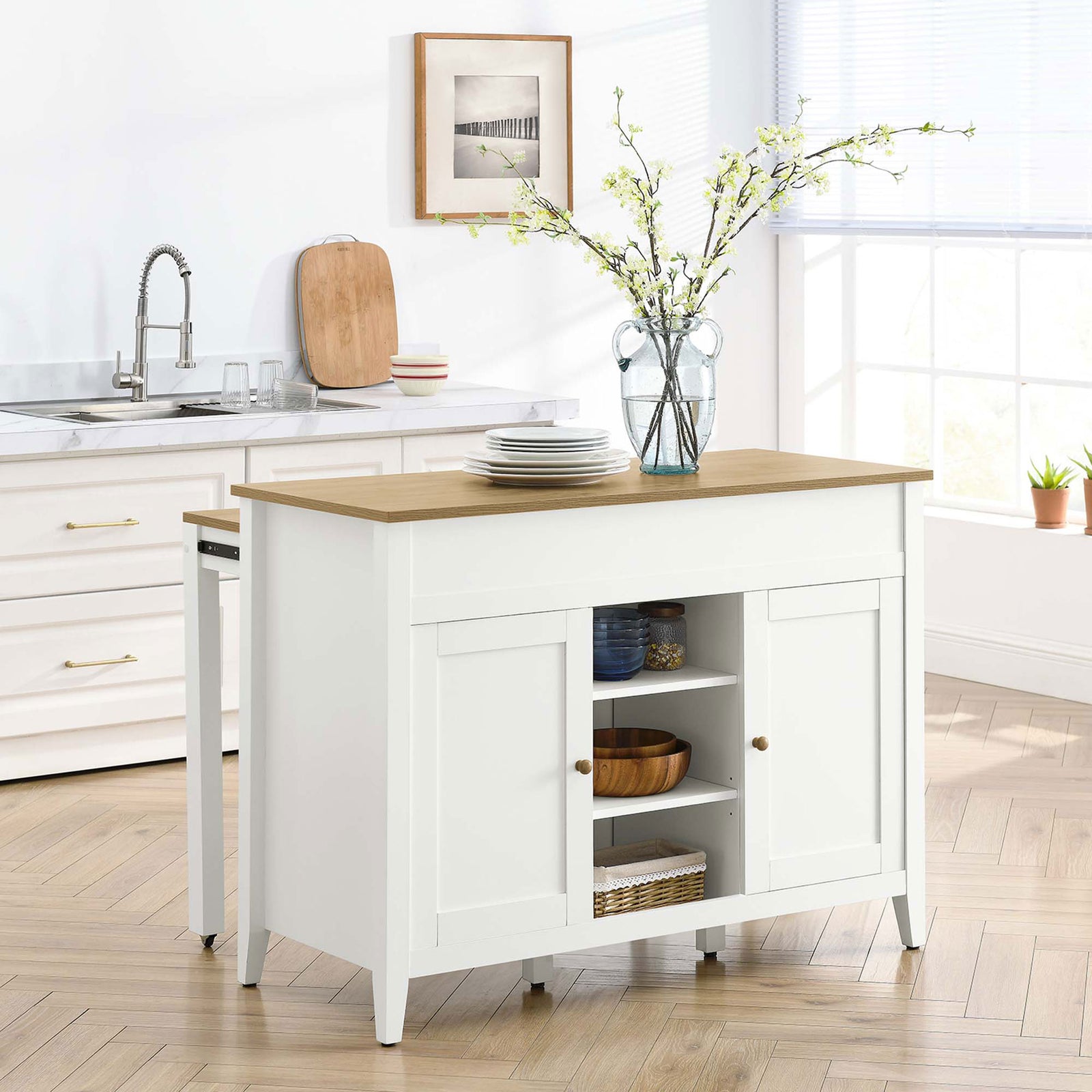 Kitchen island styled with fresh decor, showcasing the warm oak and crisp white two tone finish || EEI-6727-OAK-WHI || front_angle_room