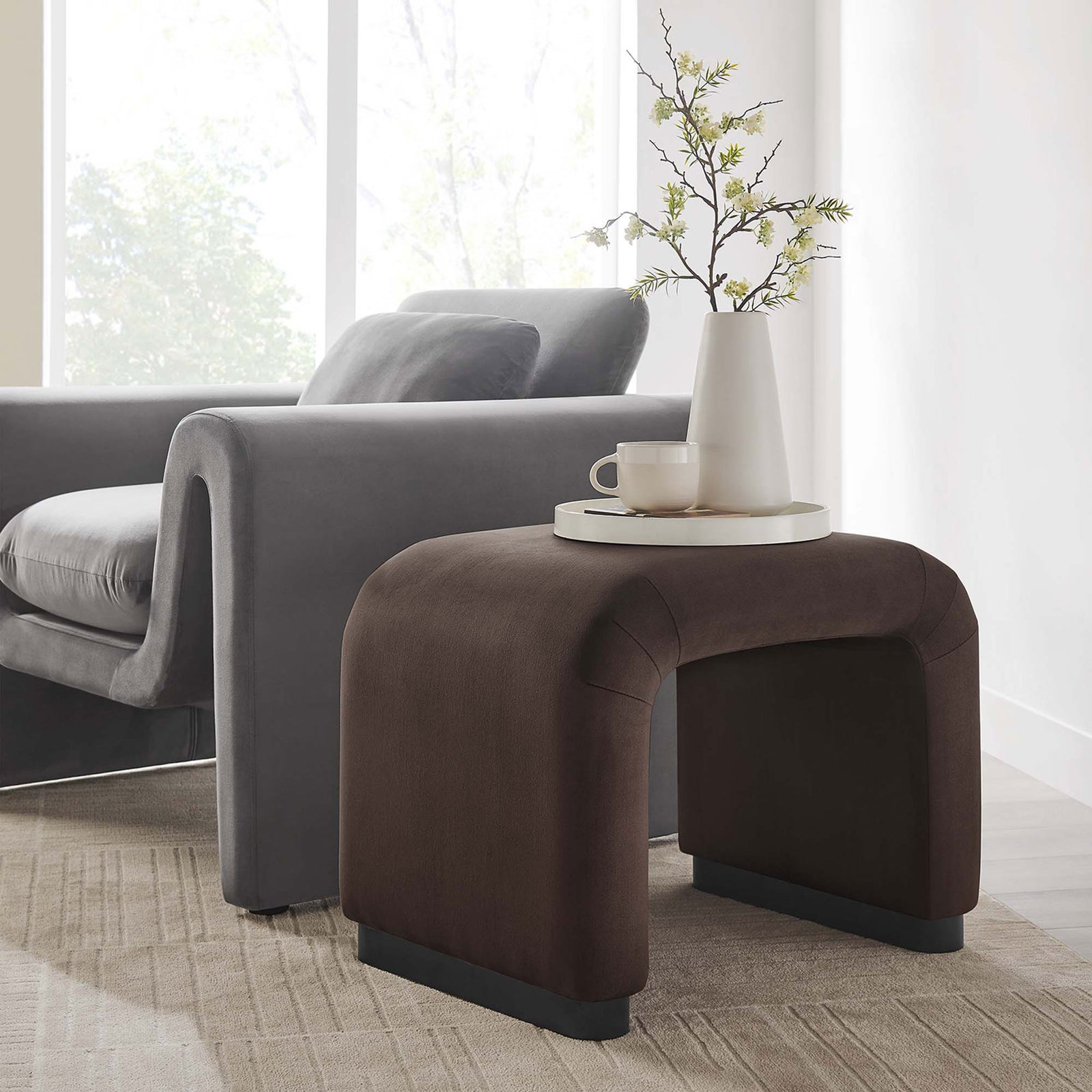 Doubles as a chic side table or extra seat with plush velvet and a sturdy base || EEI-6733-BLK-CHB || front_angle_room