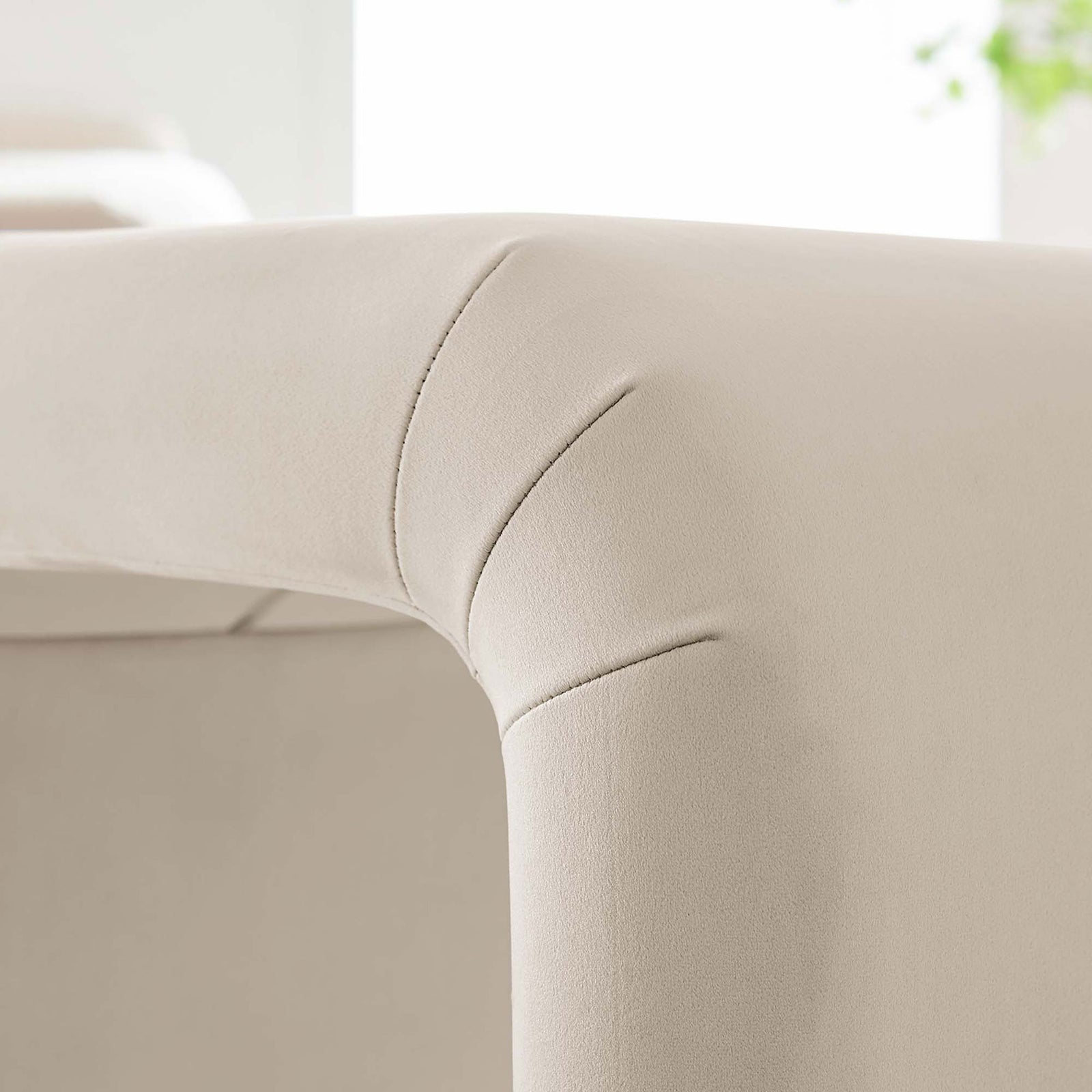 Soft velvet upholstery and subtle channel seams create a smooth, inviting touch || EEI-6733-BRA-ALM || detail_room