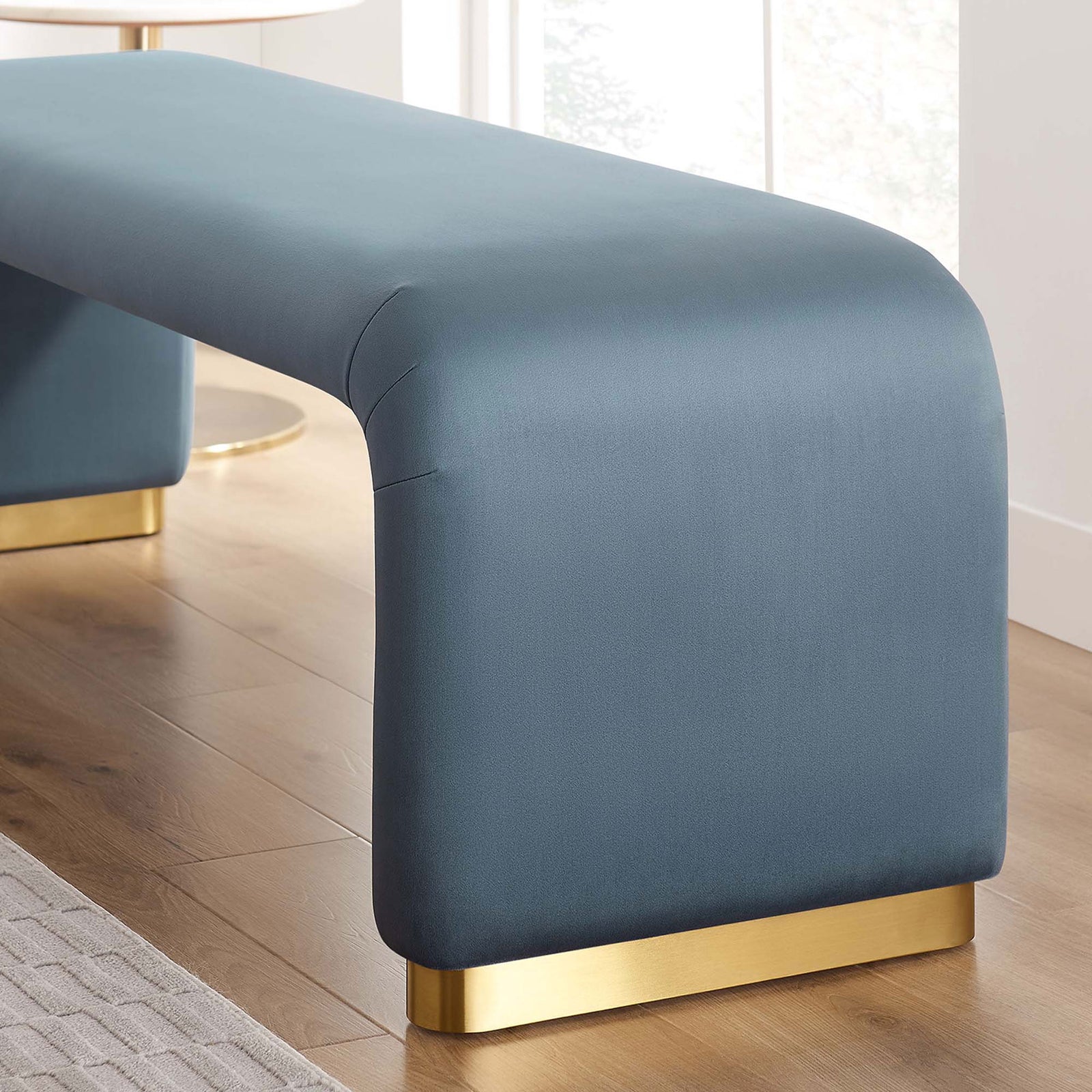 Lustrous velvet and brass base bring a luxe touch to the sculpted waterfall form. || EEI-6734-BRA-CAB || leg_room