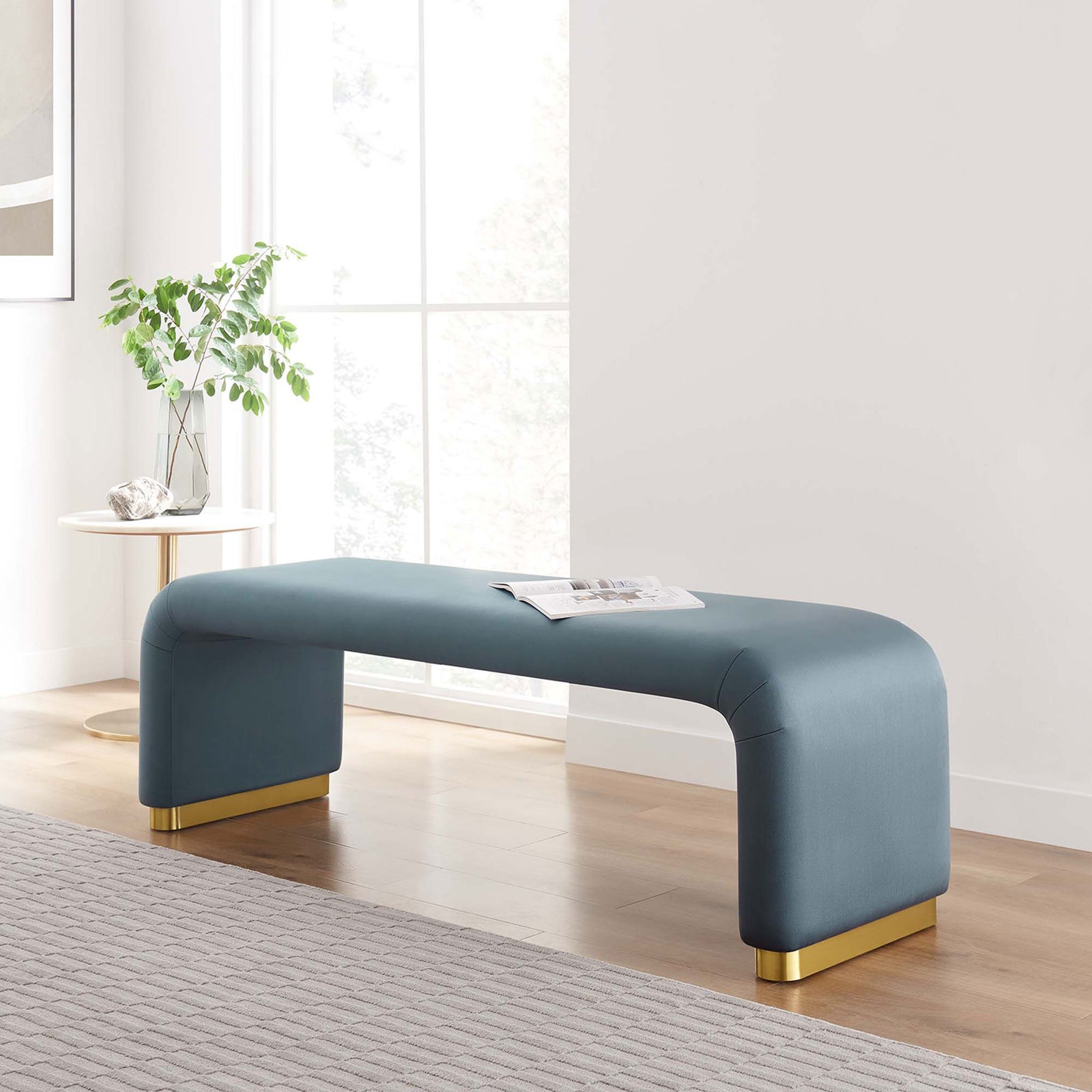 Modern blue velvet bench adds a polished brass accent and soft curves to any living space. || EEI-6734-BRA-CAB || front_angle_room