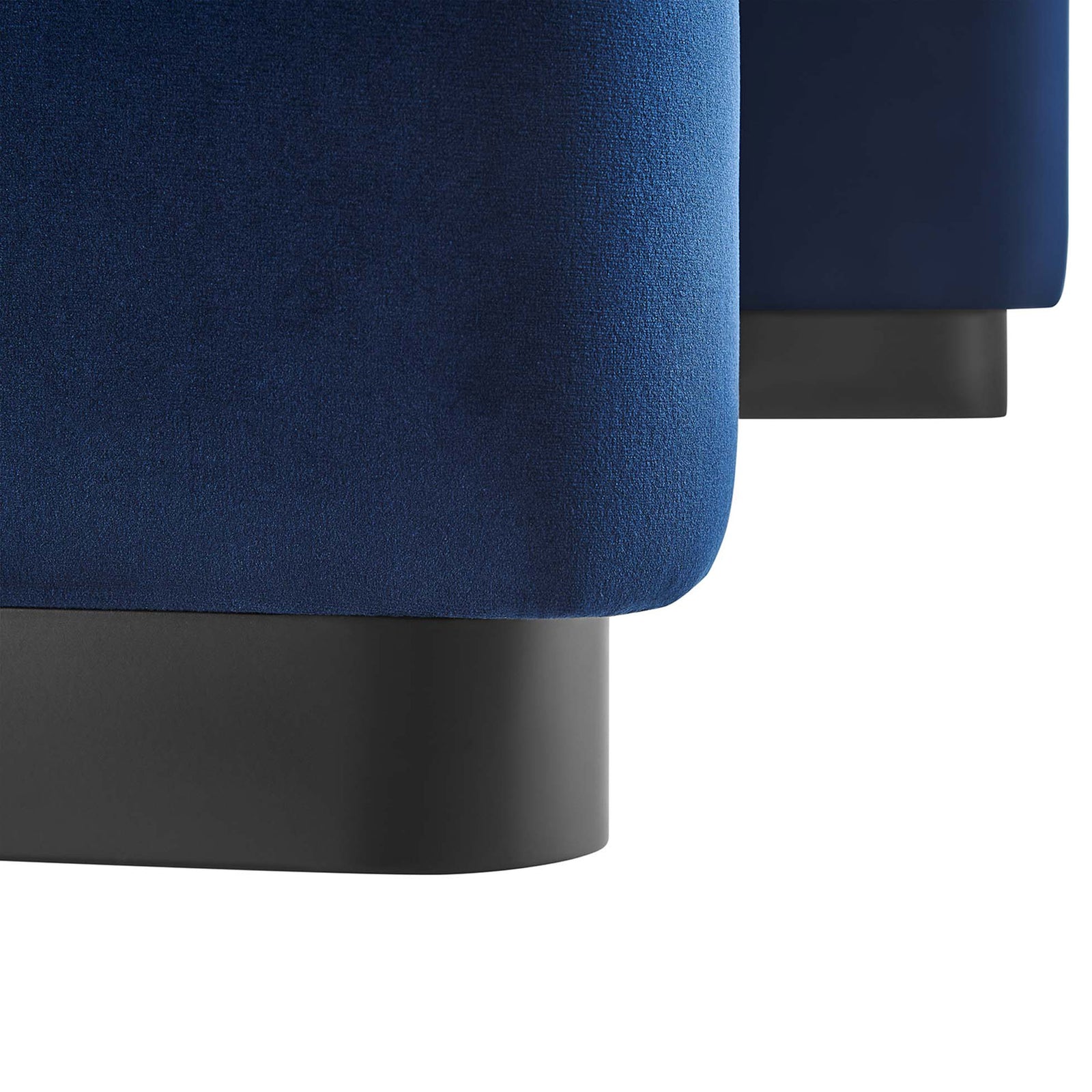 Close-up of the ottoman base, contrasting the midnight blue velvet with the black metal plinth || EEI-6735-BLK-MID || leg_studio