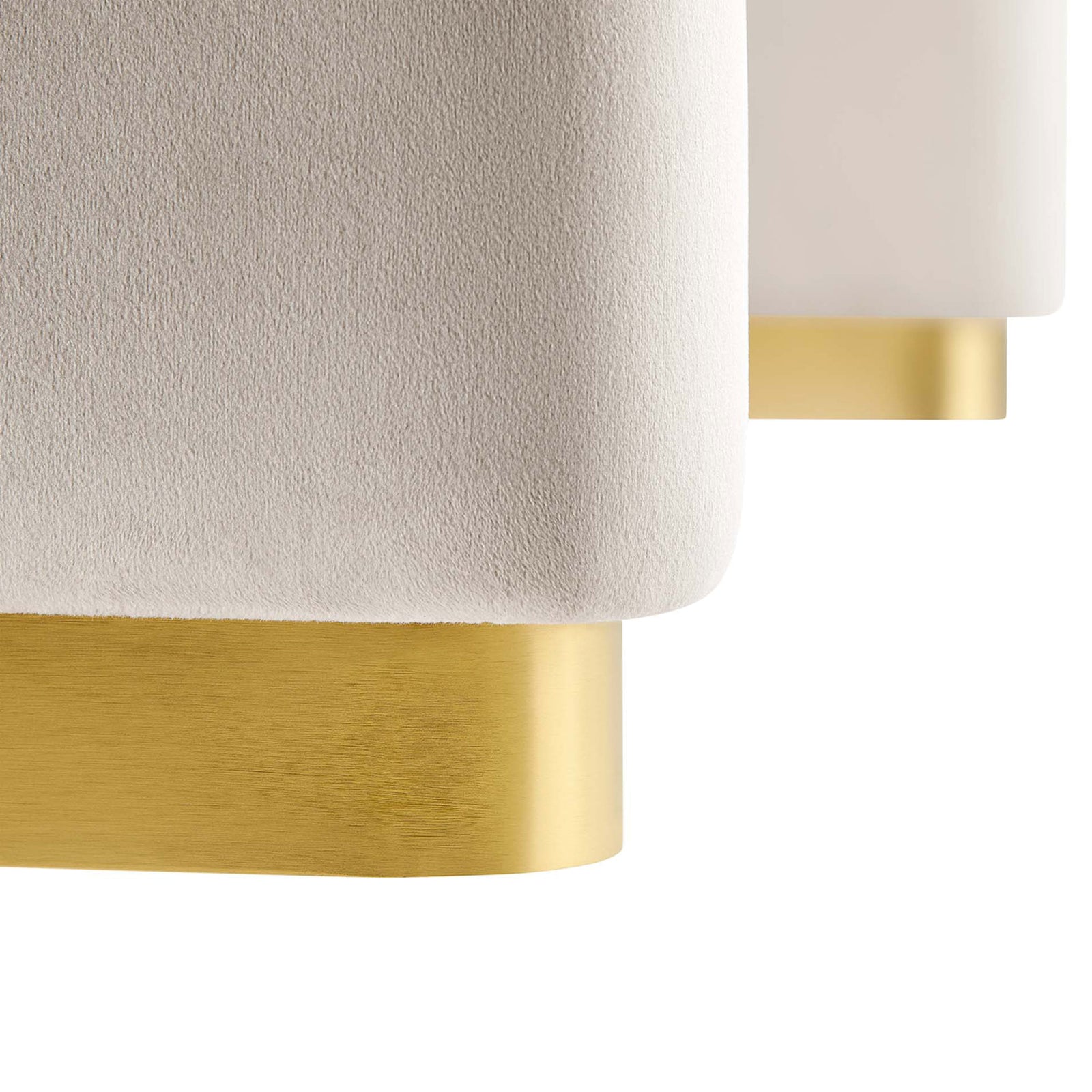 Close up of Koda ottoman brass base and plush almond performance velvet for a luxe, tailored finish || EEI-6735-BRA-ALM || leg_studio