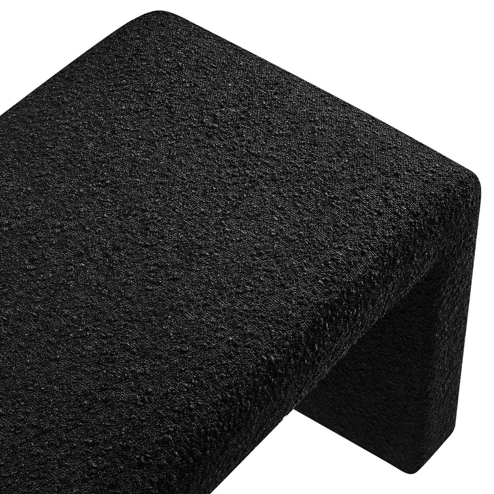 Nubby black boucle upholstery and rounded edge showcase the bench's tactile, cozy appeal || EEI-6736-BLK || detail_studio