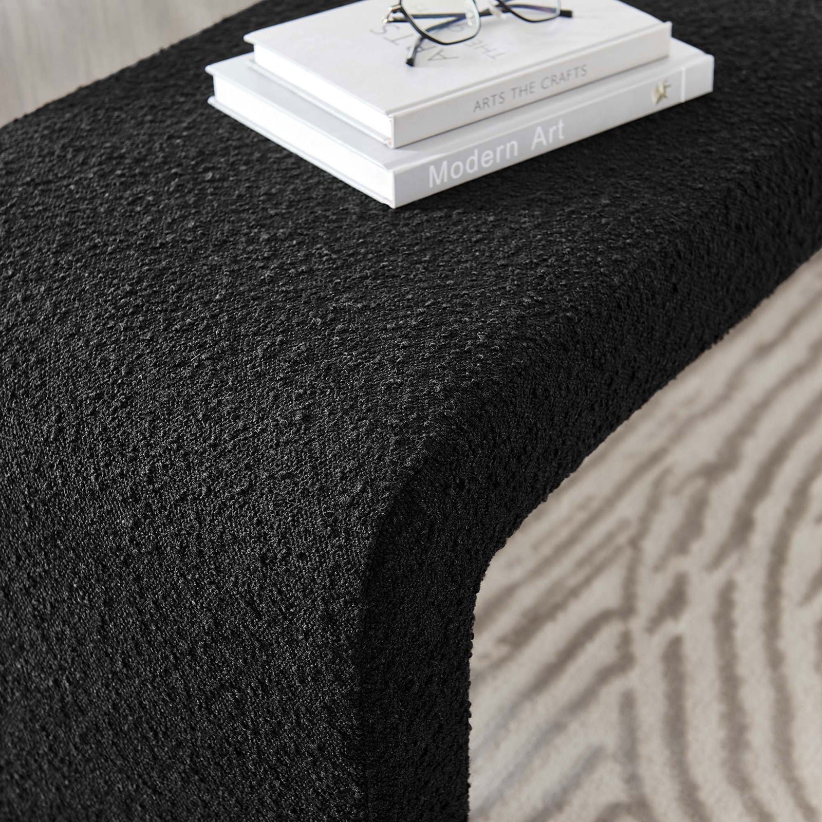 Textured black boucle surface with smooth waterfall curve creates a refined, tactile accent || EEI-6736-BLK || detail_room