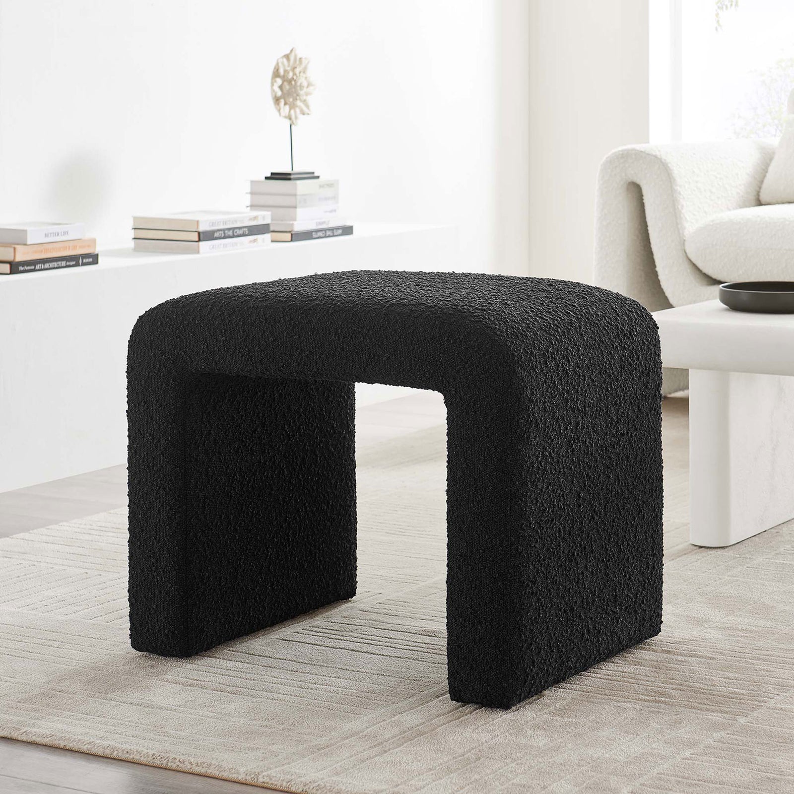 Versatile black boucle waterfall stool anchors the space as a chic seat or impromptu side table || EEI-6737-BLK || front_room