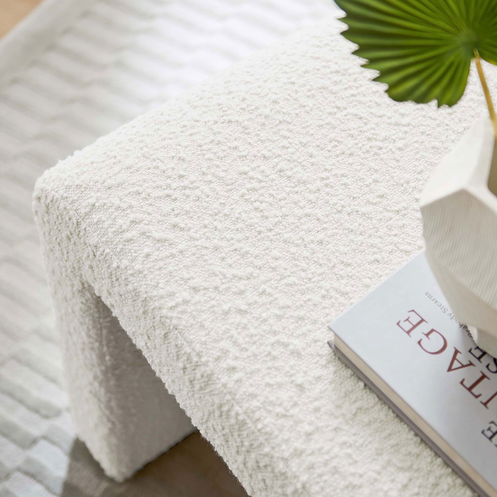 Tactile boucle surface in ivory offers a cozy, refined touch for styling books and decor || EEI-6737-IVO || detail_room