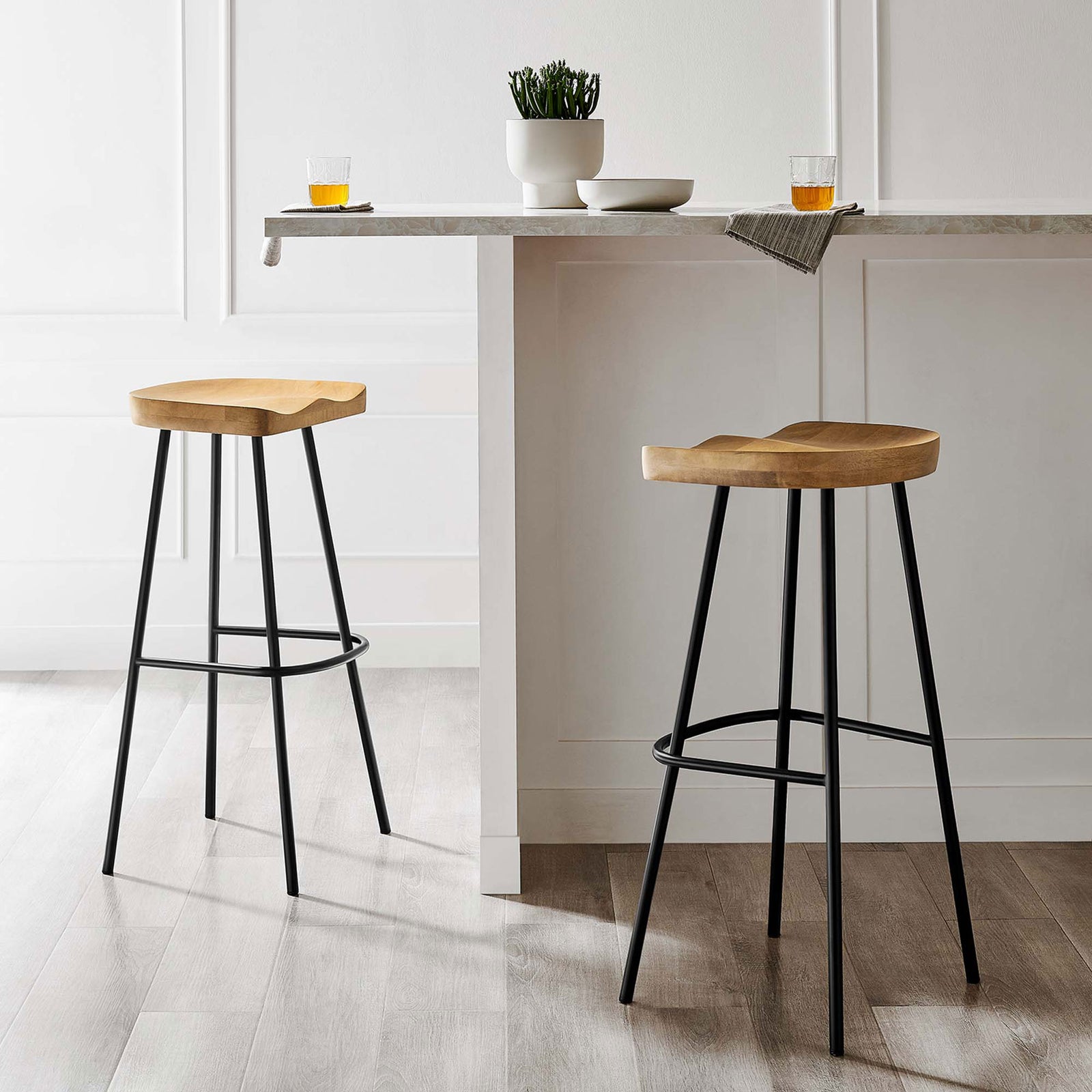 Two bar stools bring warm wood contrast and airy lines to a clean, modern kitchen || EEI-6742-OAK || front_angle_multi_room