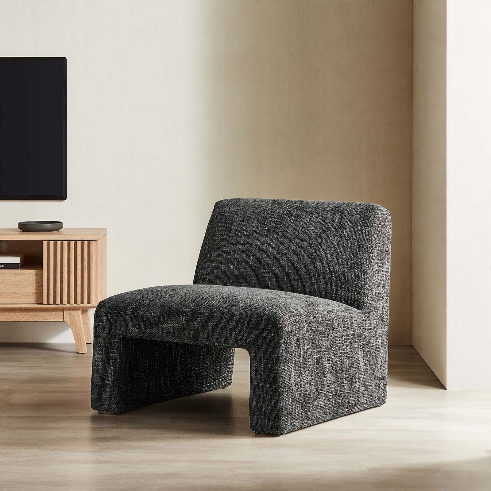Elevates modern living rooms with a clean, armless form and inviting texture || EEI-6765-CAR || front_angle_room
