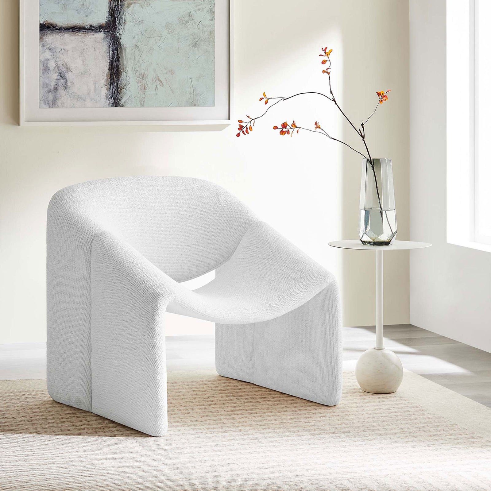 Modern accent chair in frost white chenille elevates a serene living space with its sculptural, airy form || EEI-6767-FRO || front_angle_room