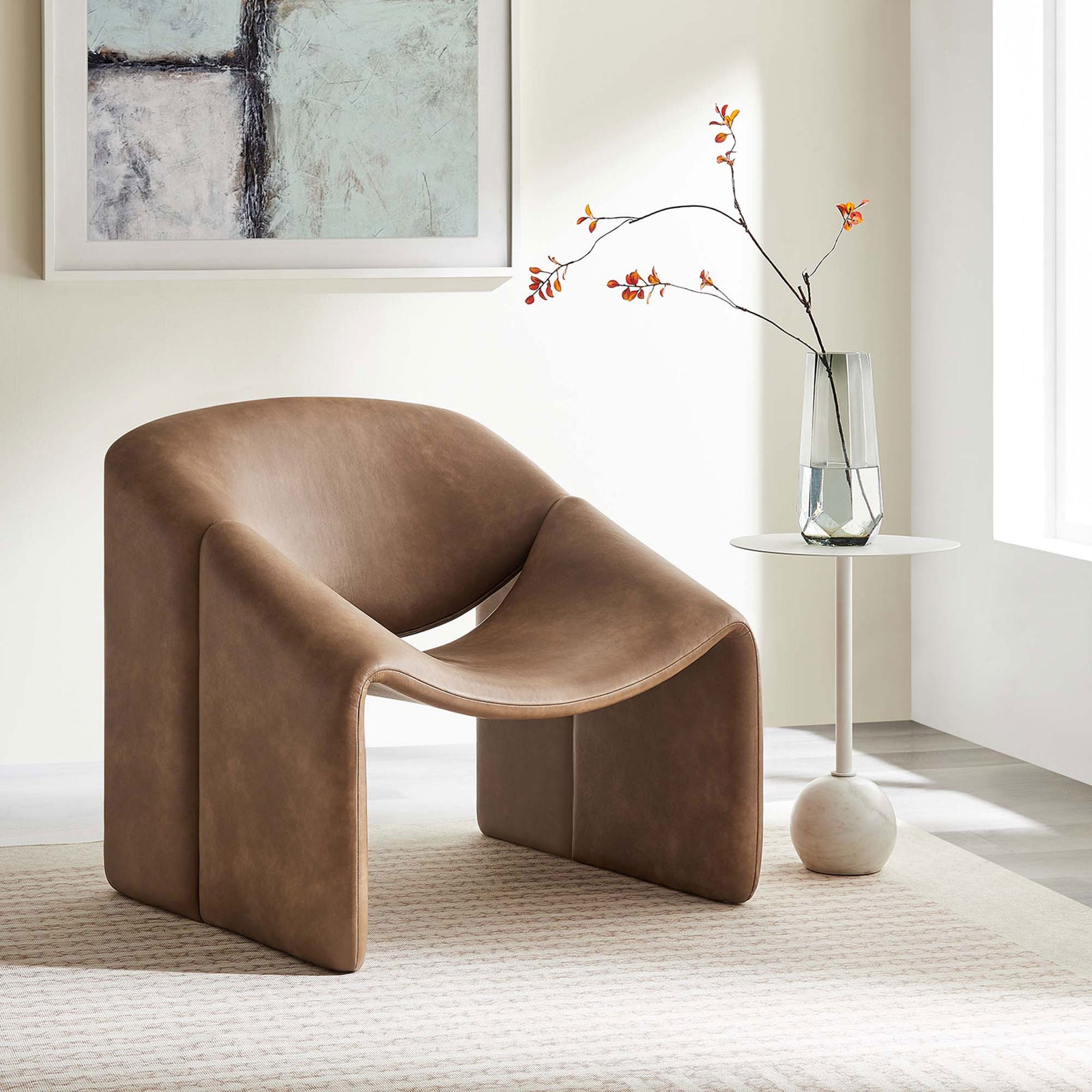 Modern barrel lounge chair brings a warm brown tone and sculptural form to the living space || EEI-6768-BRN || front_angle_room