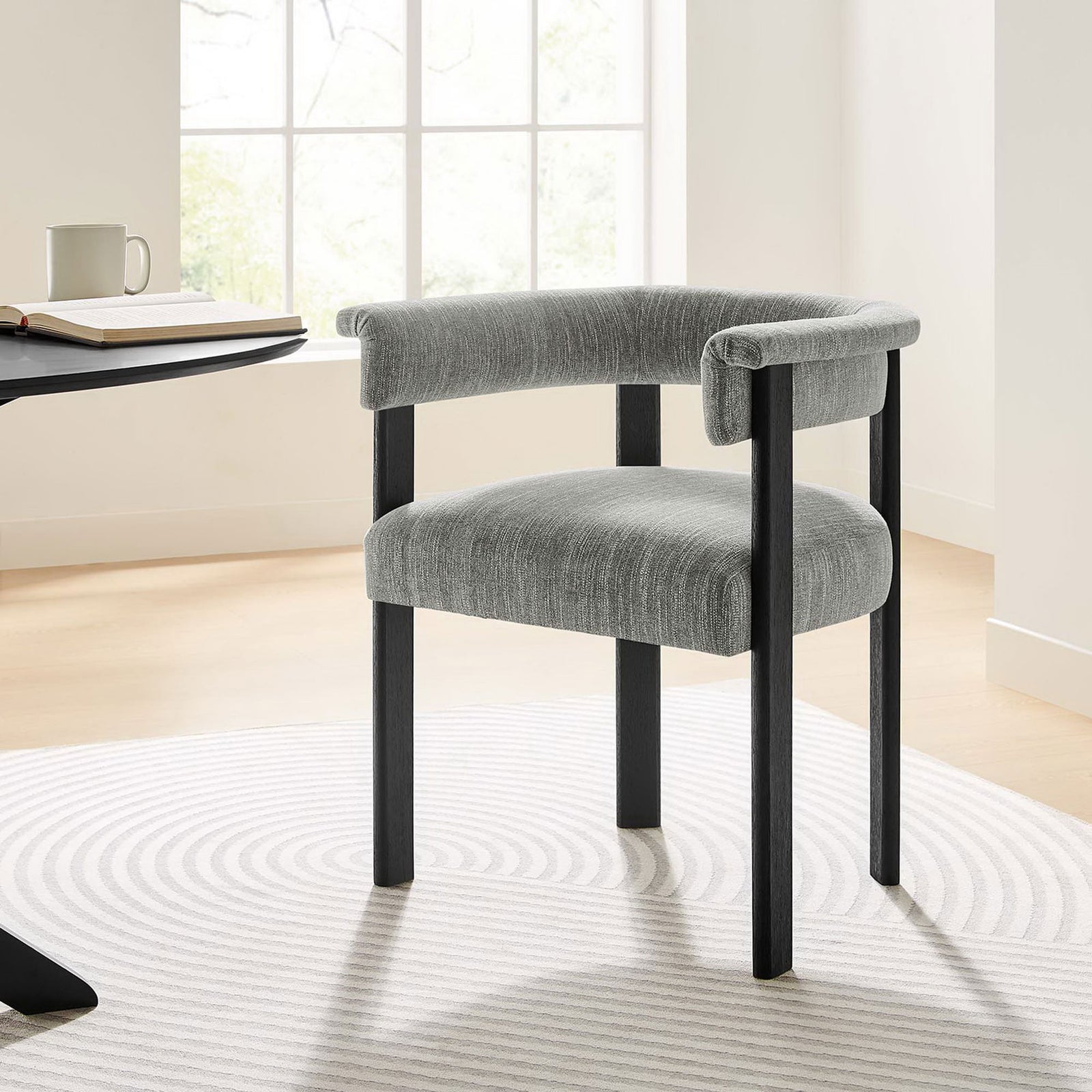 Imogen dining chair brings soft gray comfort and graphic black legs to a bright modern dining space || EEI-6776-HEG-BLK || front_angle_room