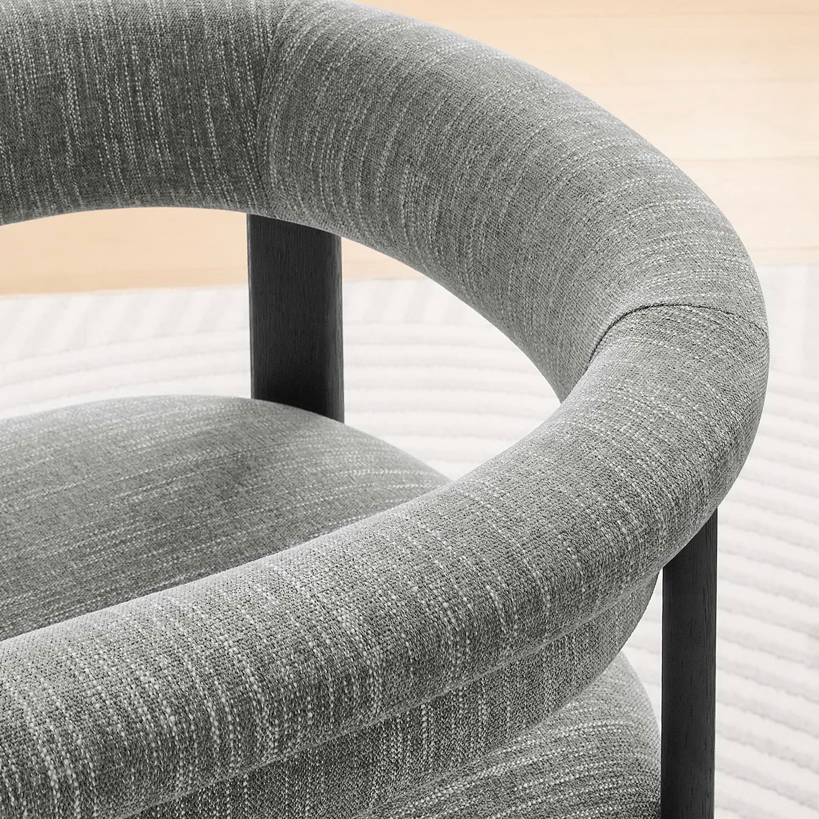 Barrel back gently curves around you, pairing textured gray fabric with airy, light-filled surroundings || EEI-6776-HEG-BLK || detail_room