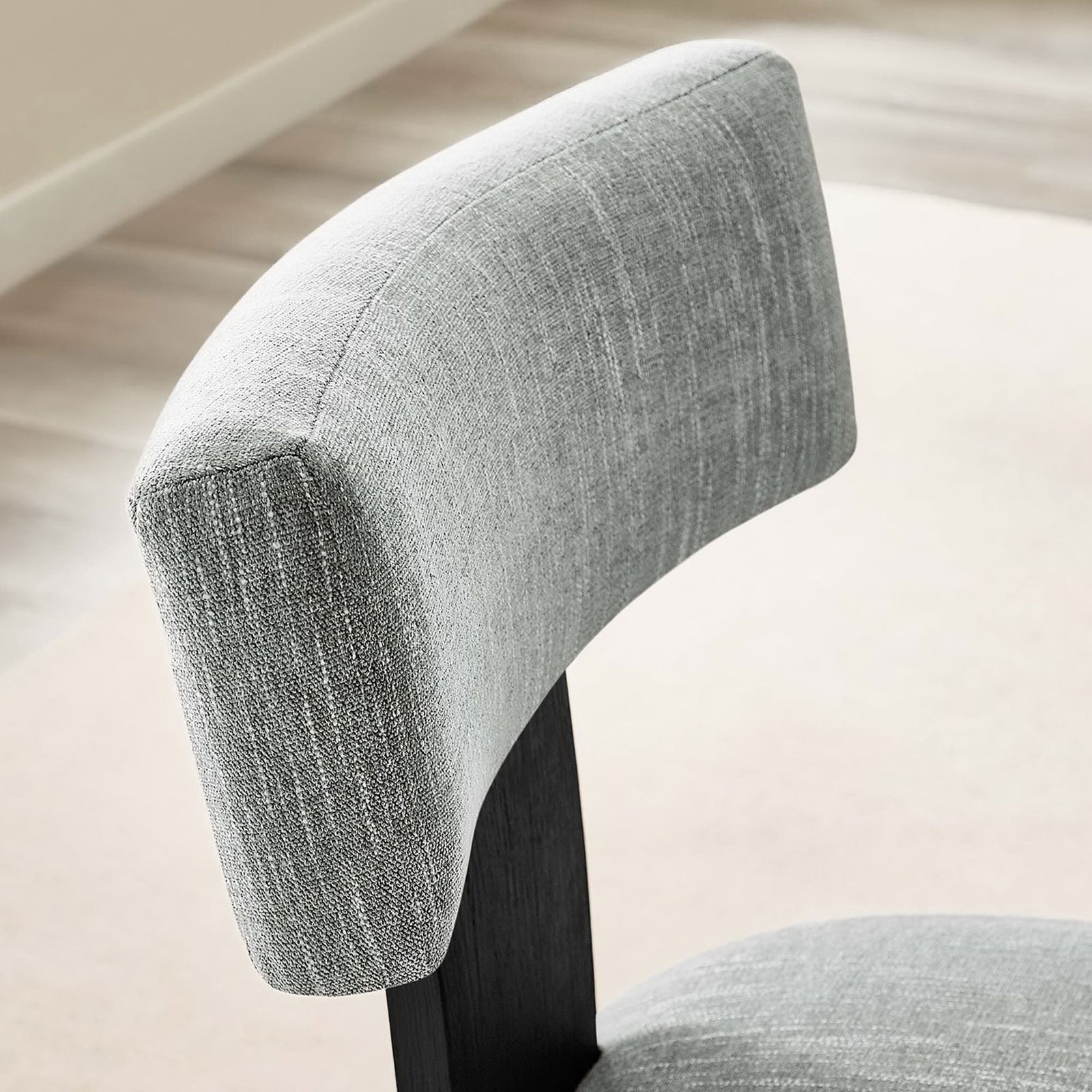 Heathered gray back cushion adds soft texture and comfort to this modern dining chair || EEI-6777-HEG-BLK || detail_room