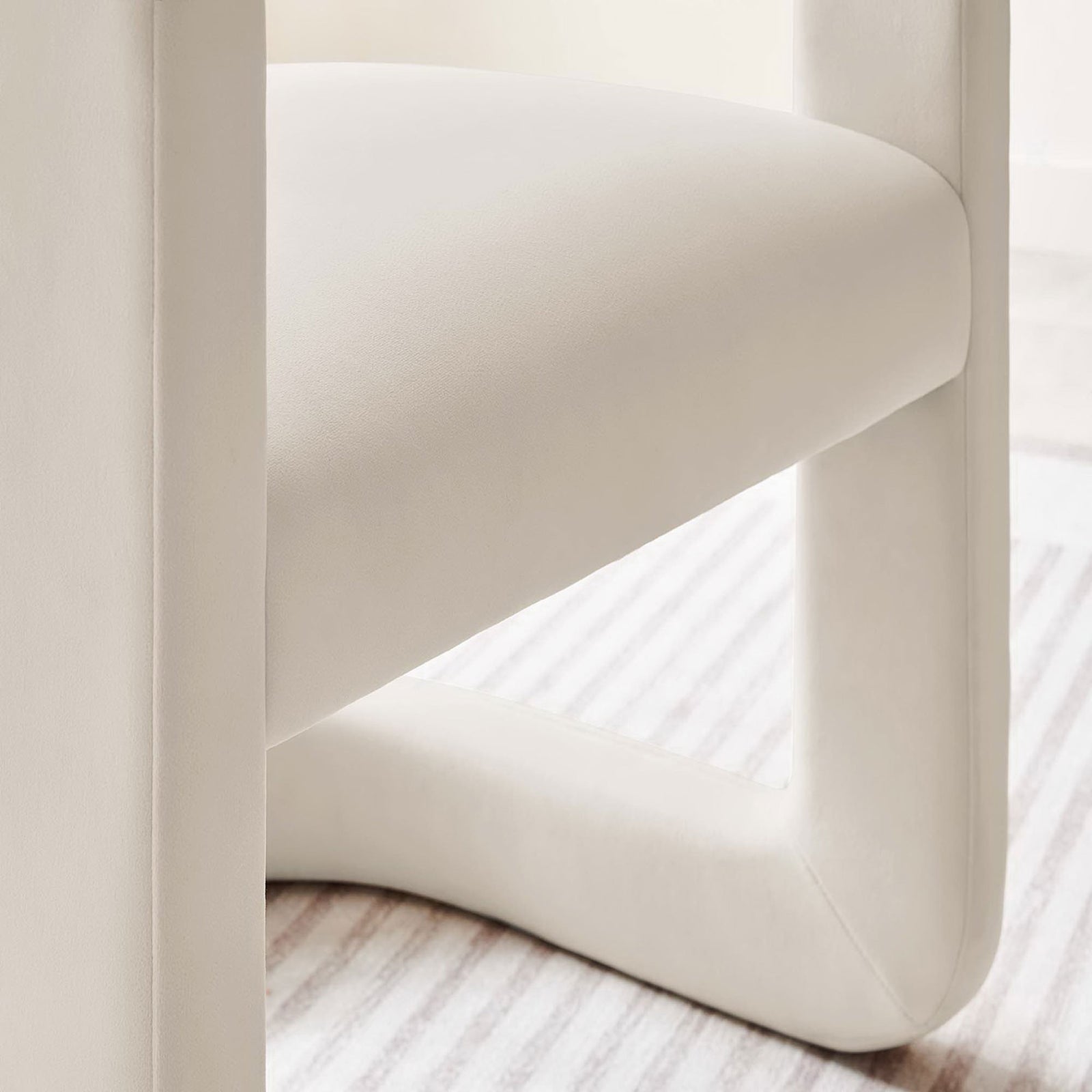 Velvet seat and sculpted base add softness to a serene living space || EEI-6778-ALA || detail_room