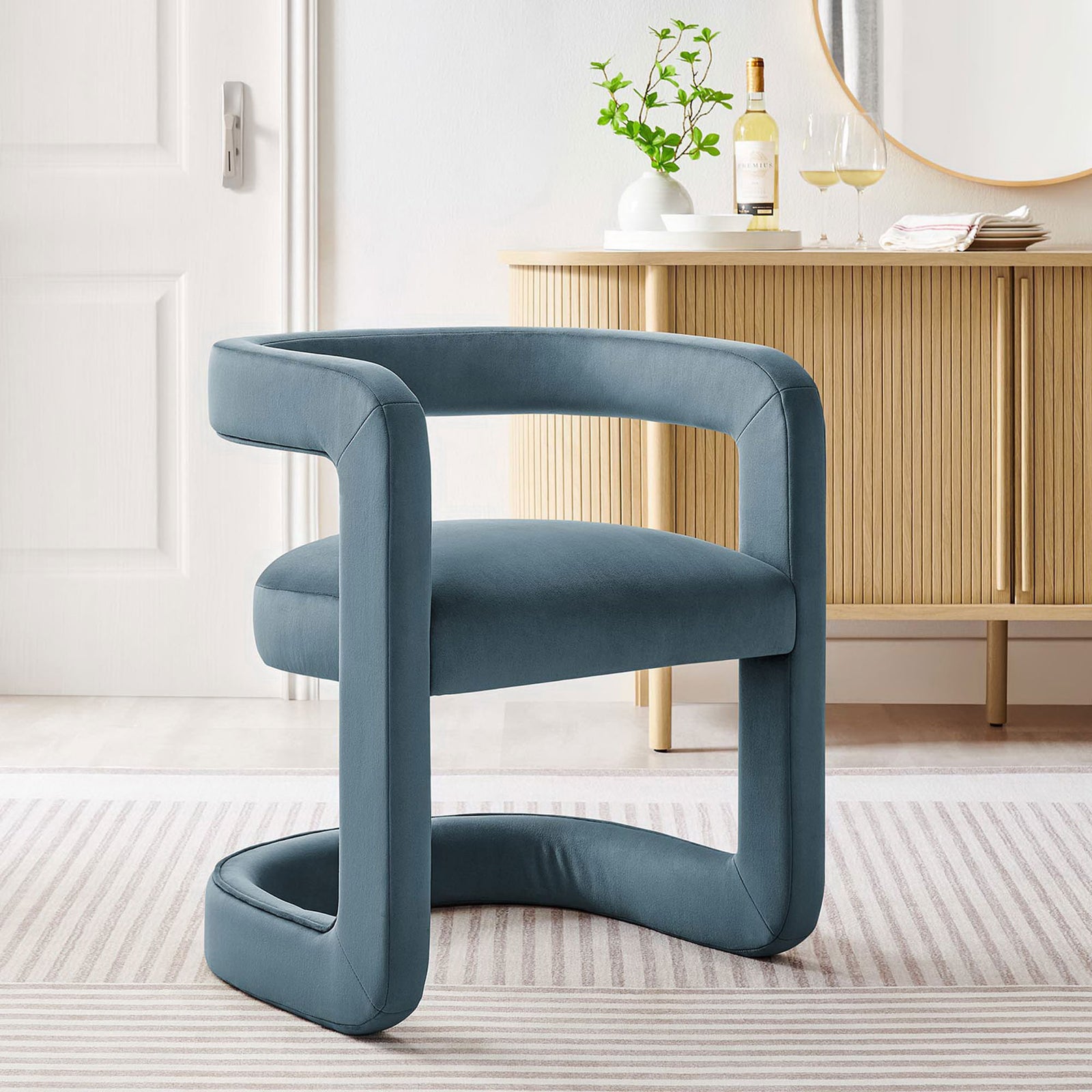 Modern cadet blue velvet chair adds sculptural style to the living room || EEI-6778-CAB || front_angle_room