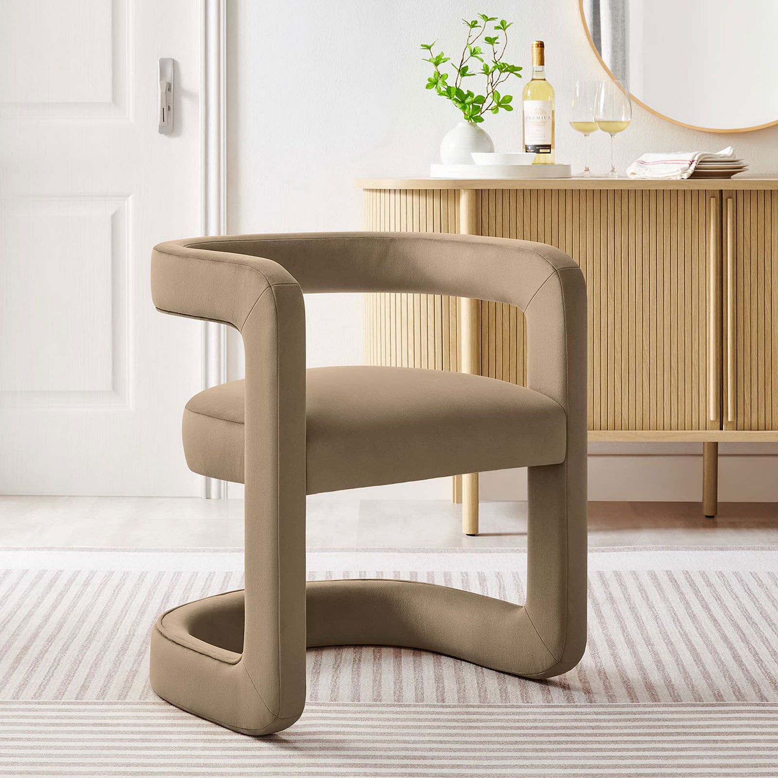 Open-back barrel chair brings contemporary style and inviting comfort in versatile taupe velvet. || EEI-6778-TAU || front_angle_room