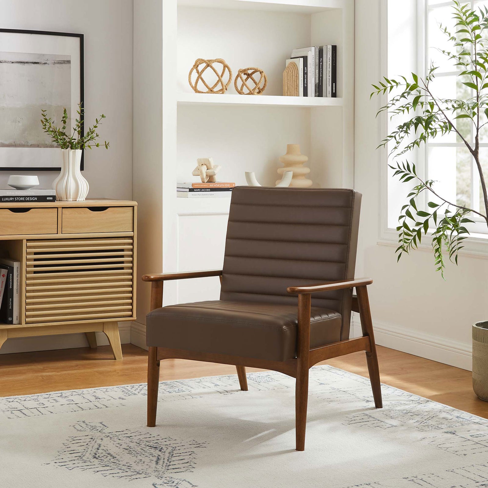 Elevates the living room with rich brown upholstery, warm wood tones, and a clean mid-century silhouette. || EEI-6779-WAL-BRN || front_angle_room