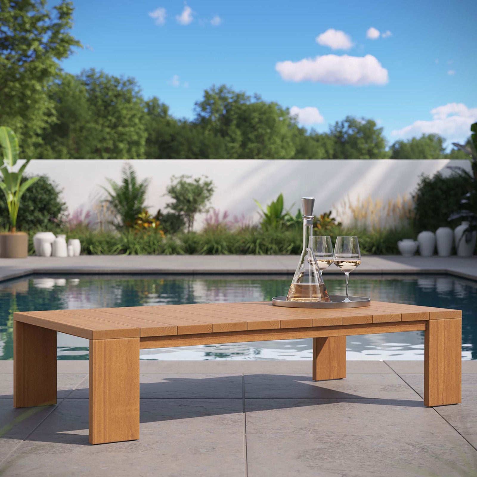Natural acacia outdoor coffee table styled by the pool for a relaxed resort-inspired patio || EEI-6786-NAT || front_angle_room