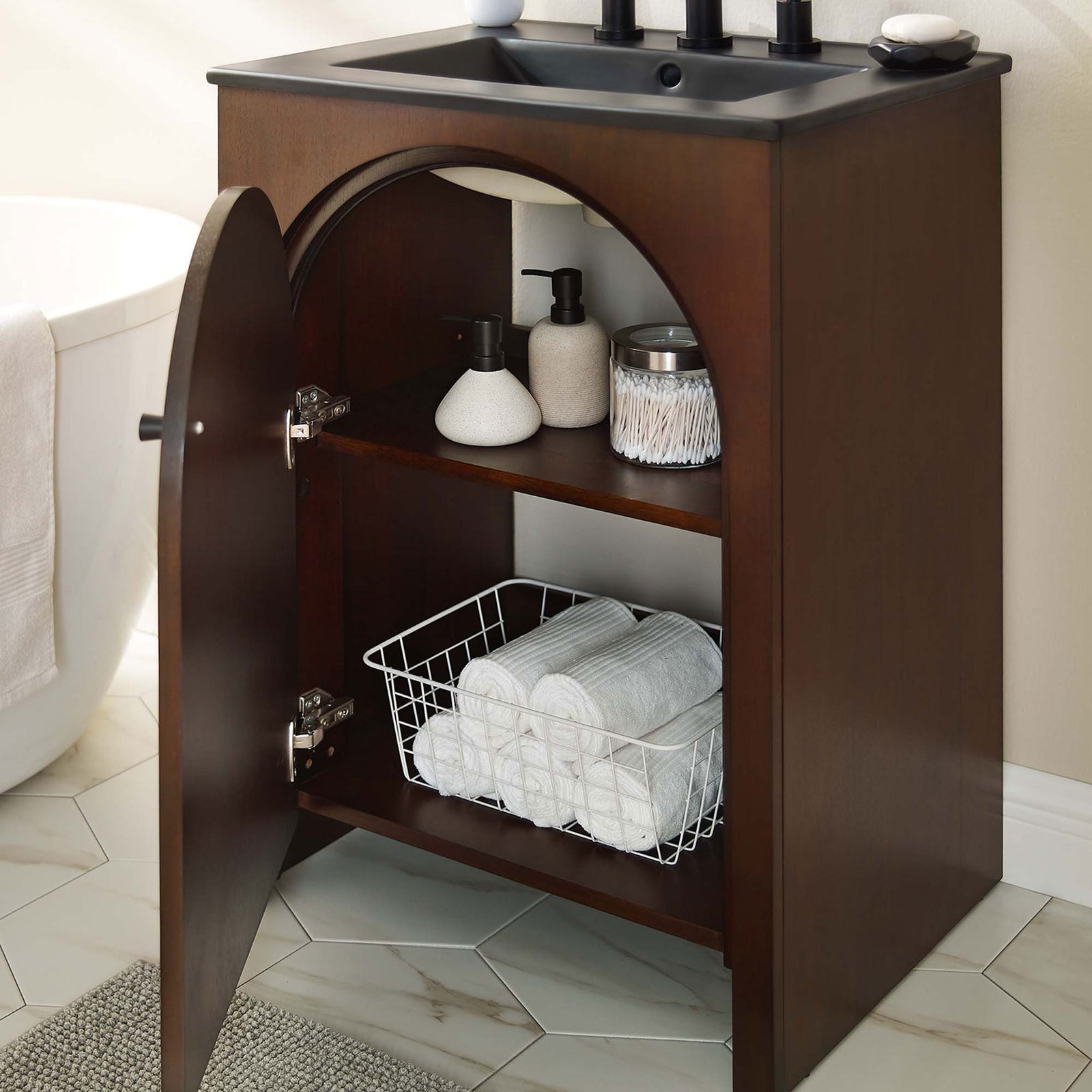 Open arched door reveals organized storage on the adjustable shelf in a bright bathroom setting. || EEI-6789-WAL-BLK || front_angle_open_room