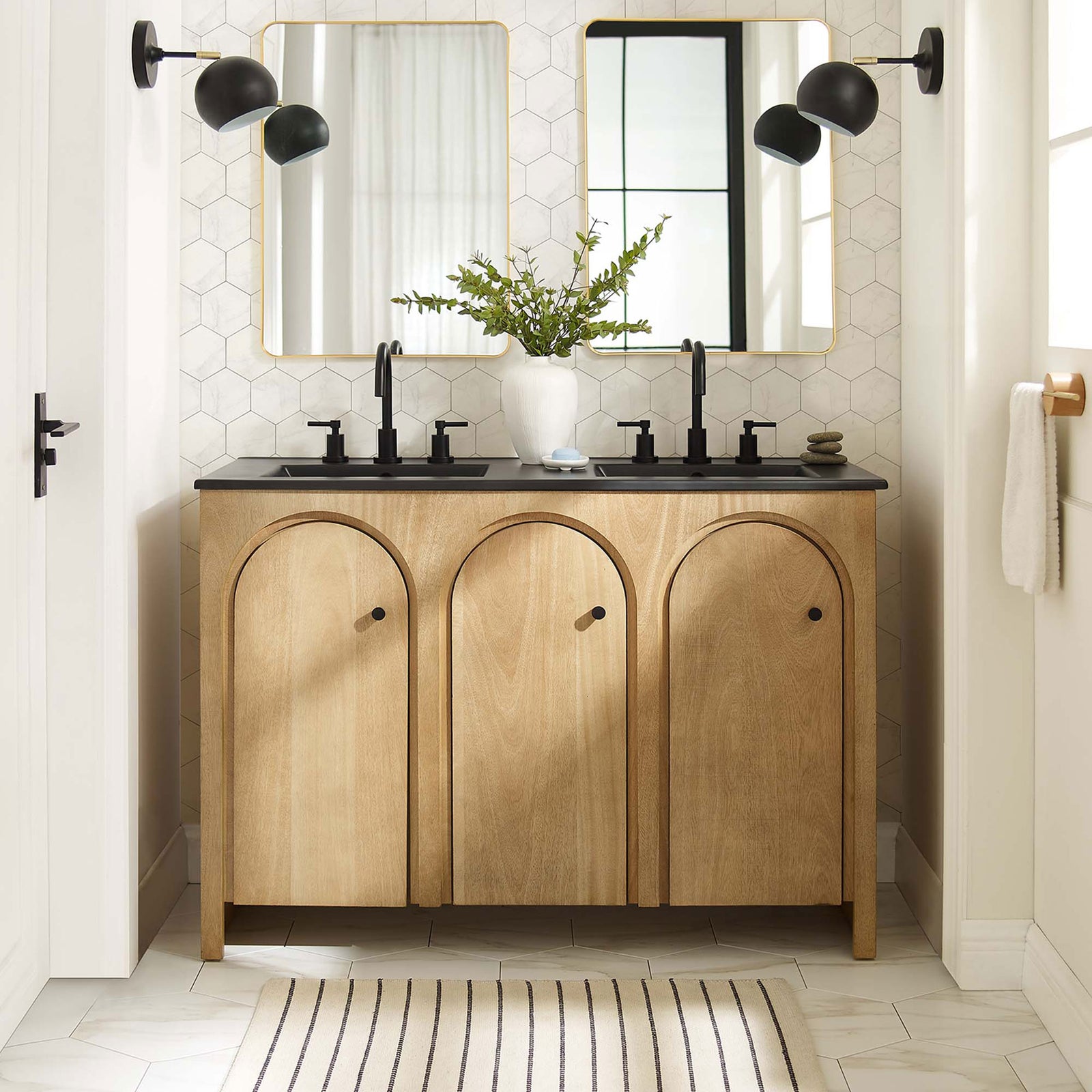 Warm oak finish and graceful arches anchor a modern double-sink centerpiece in the bath || EEI-6793-OAK-BLK || front_room