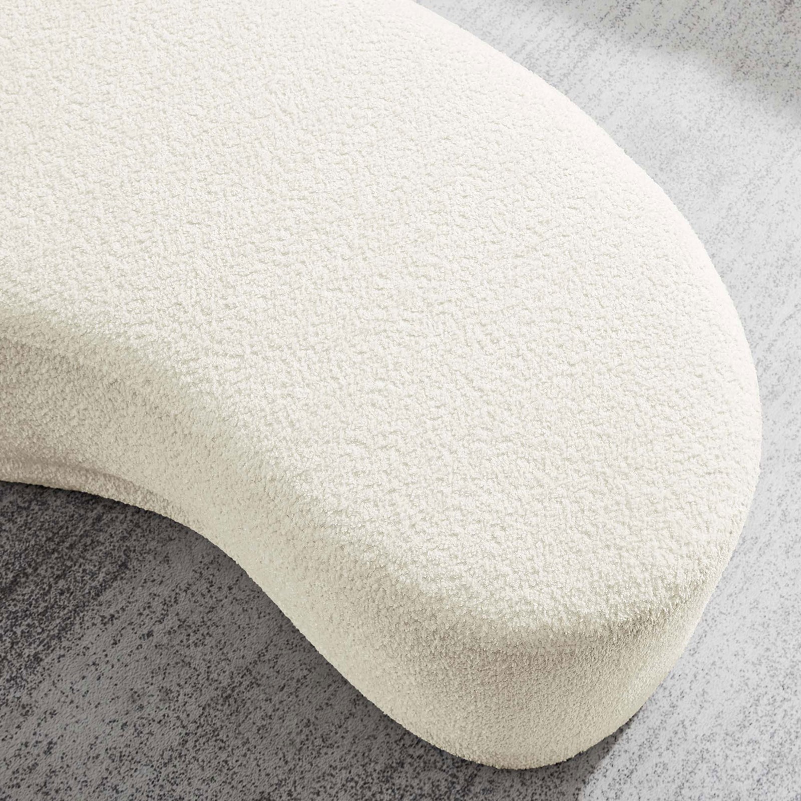 Cream chenille ottoman bench rests on a soft gray rug, showcasing its cozy, nubby texture. || EEI-6816-CRE || detail_room