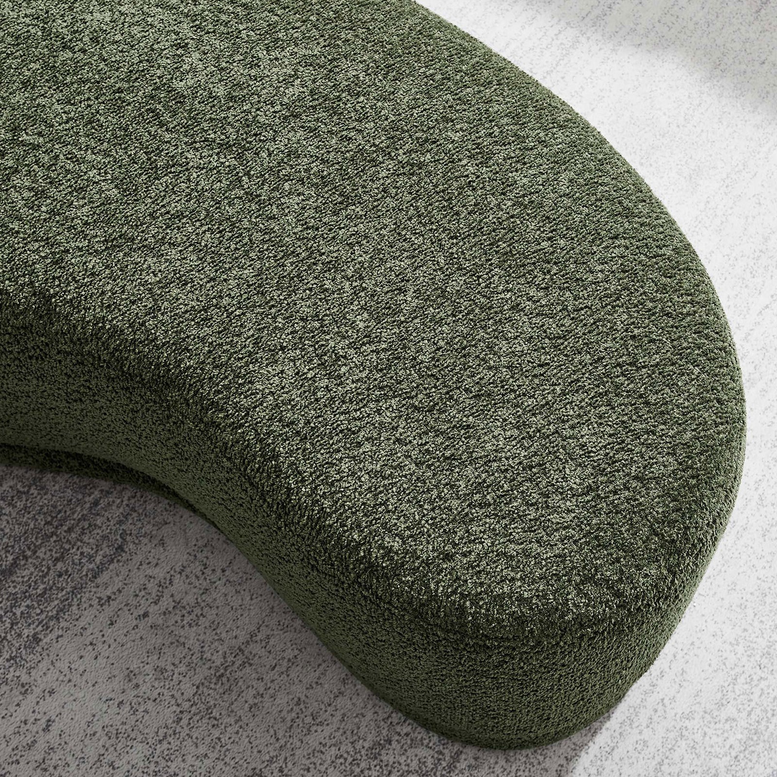 Textured sage green chenille surface of the Nimbus ottoman styled on a light, neutral area rug. || EEI-6816-SGE || detail_room