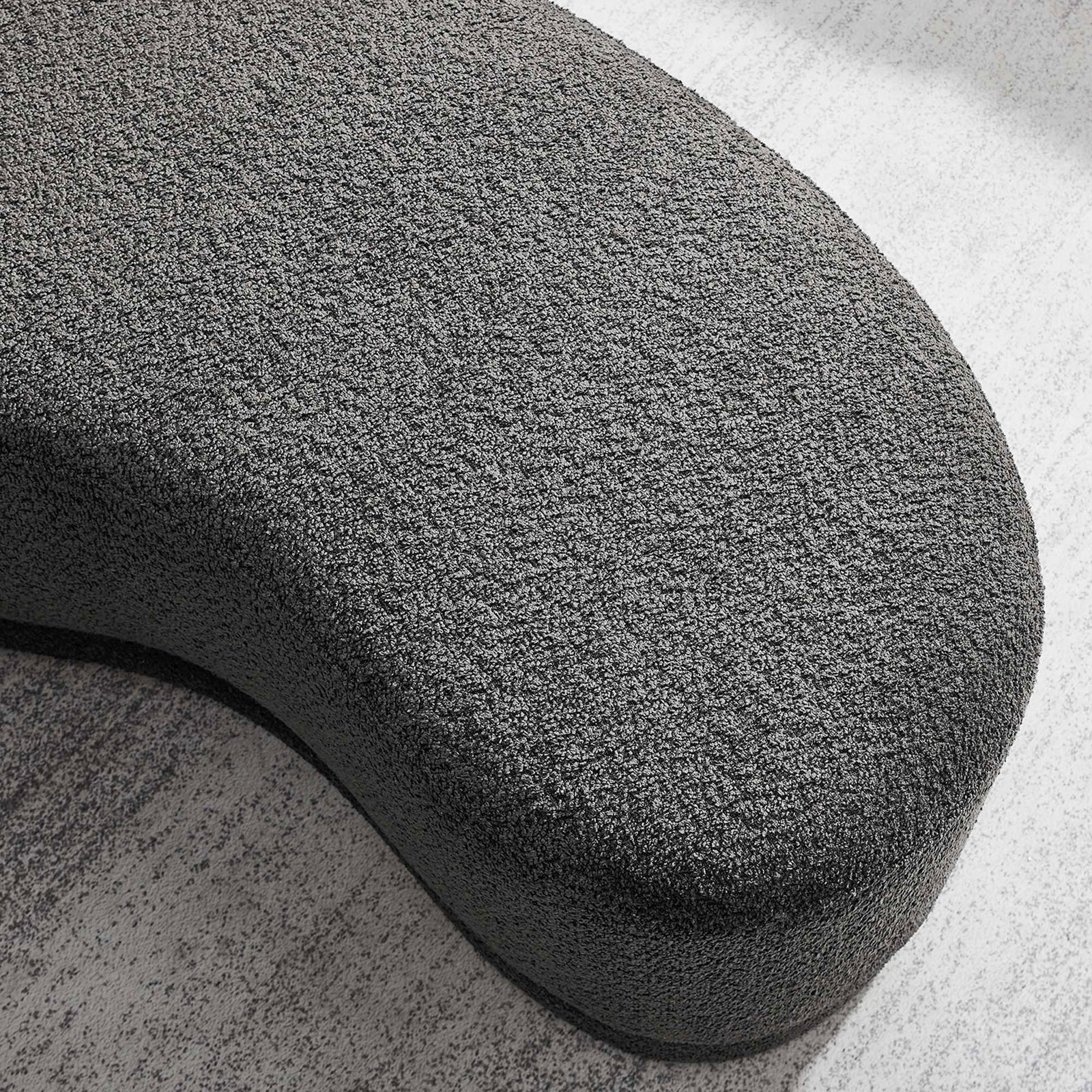 Textured dark gray chenille surface of the ottoman bench styled on a light area rug. || EEI-6816-SLA || detail_room