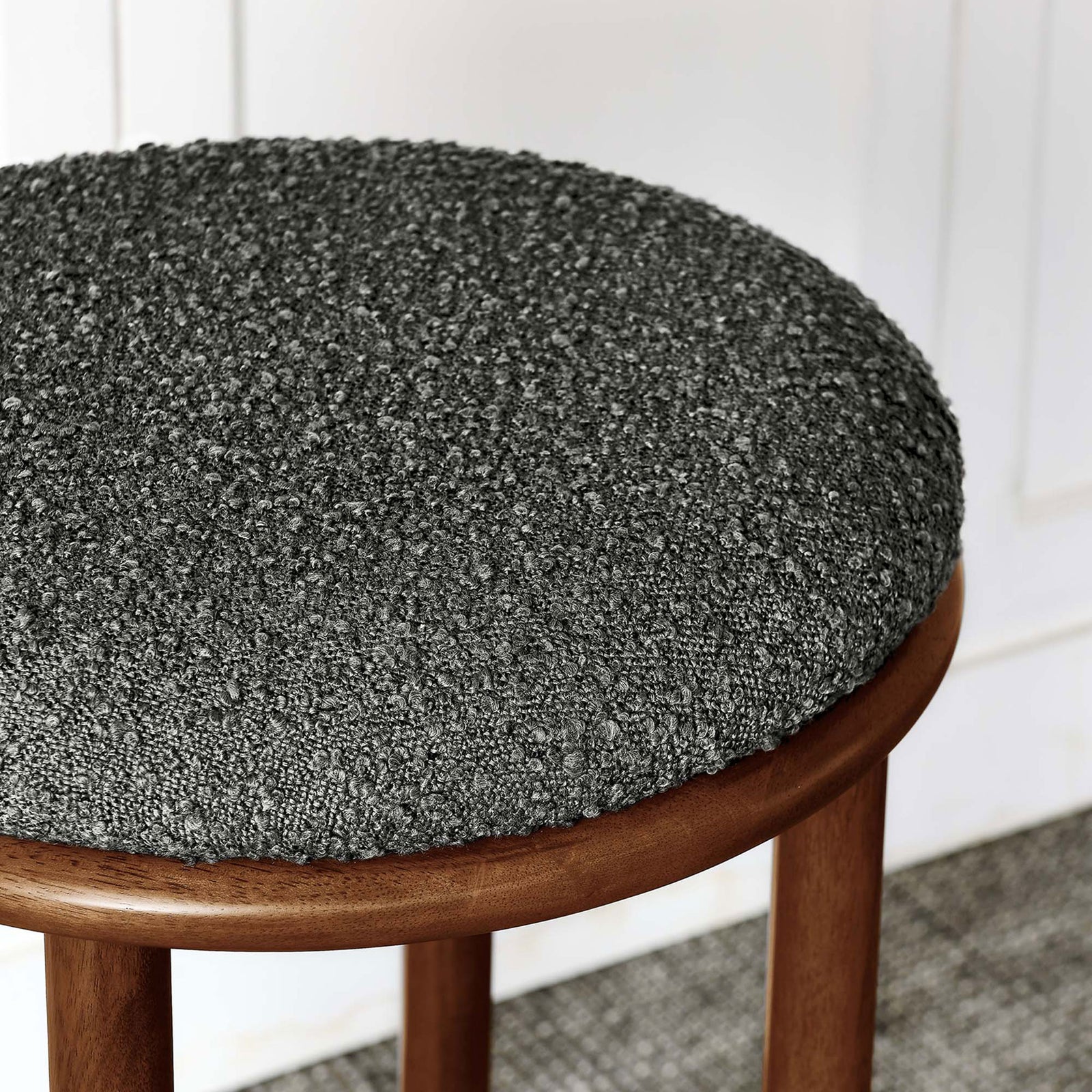 Nubby charcoal boucle upholstery brings inviting texture and style to seating || EEI-6819-WAL-CHA || detail_room