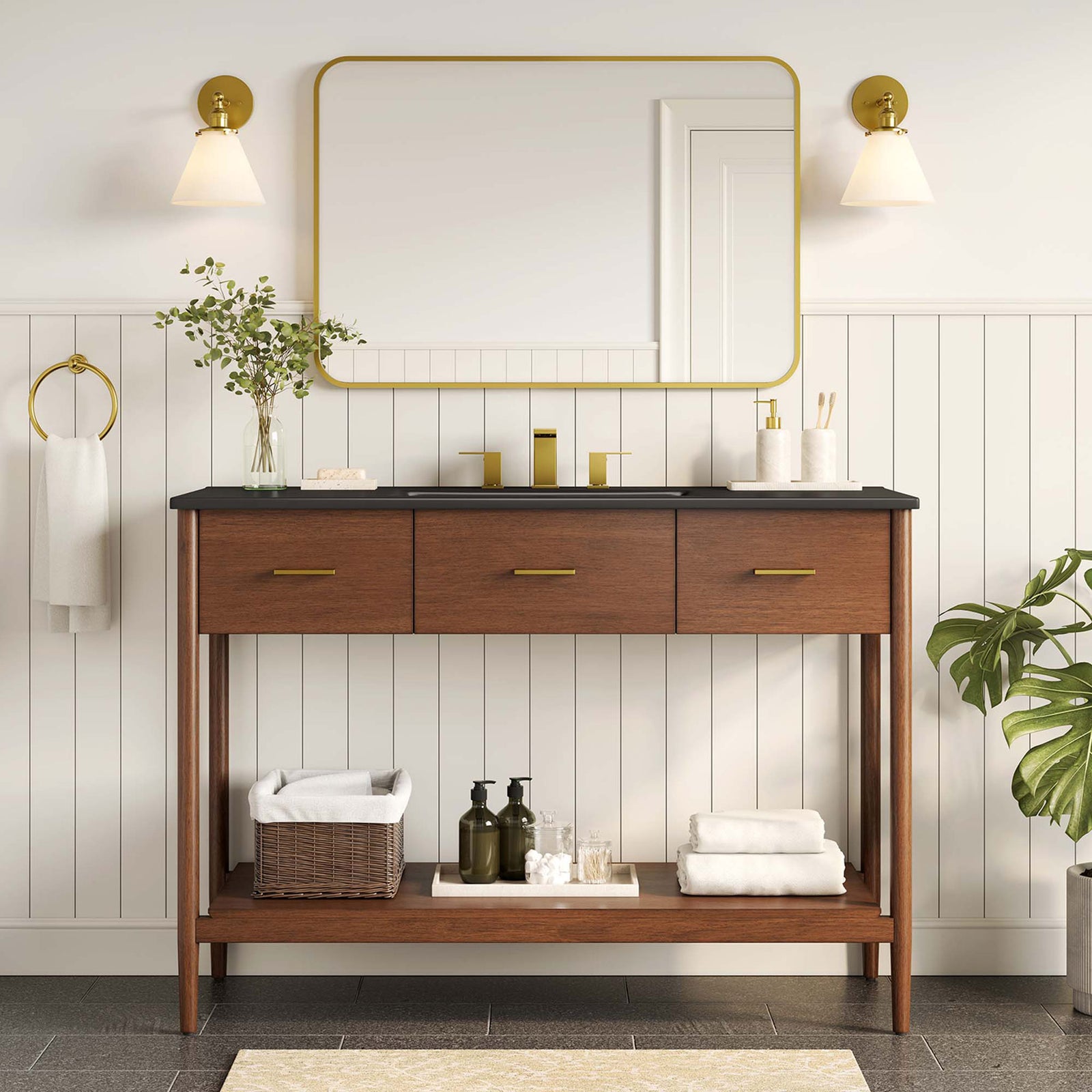 Refined walnut vanity pairs black countertop with brass accents for a modern bathroom || EEI-6825-WAL-BLK || front_room
