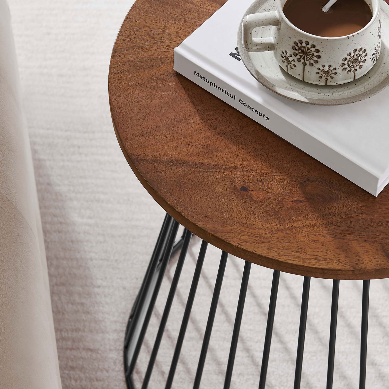 Walnut mango wood side table styled with a book and mug beside a sofa in a cozy living room || EEI-6831-WAL || detail_room