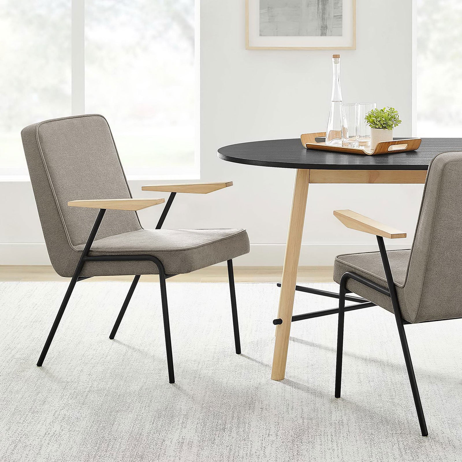 Pair of Vista sand armchairs around a modern dining table, showcasing mid-century lines and wood accents || EEI-6835-SAN || front_angle_room