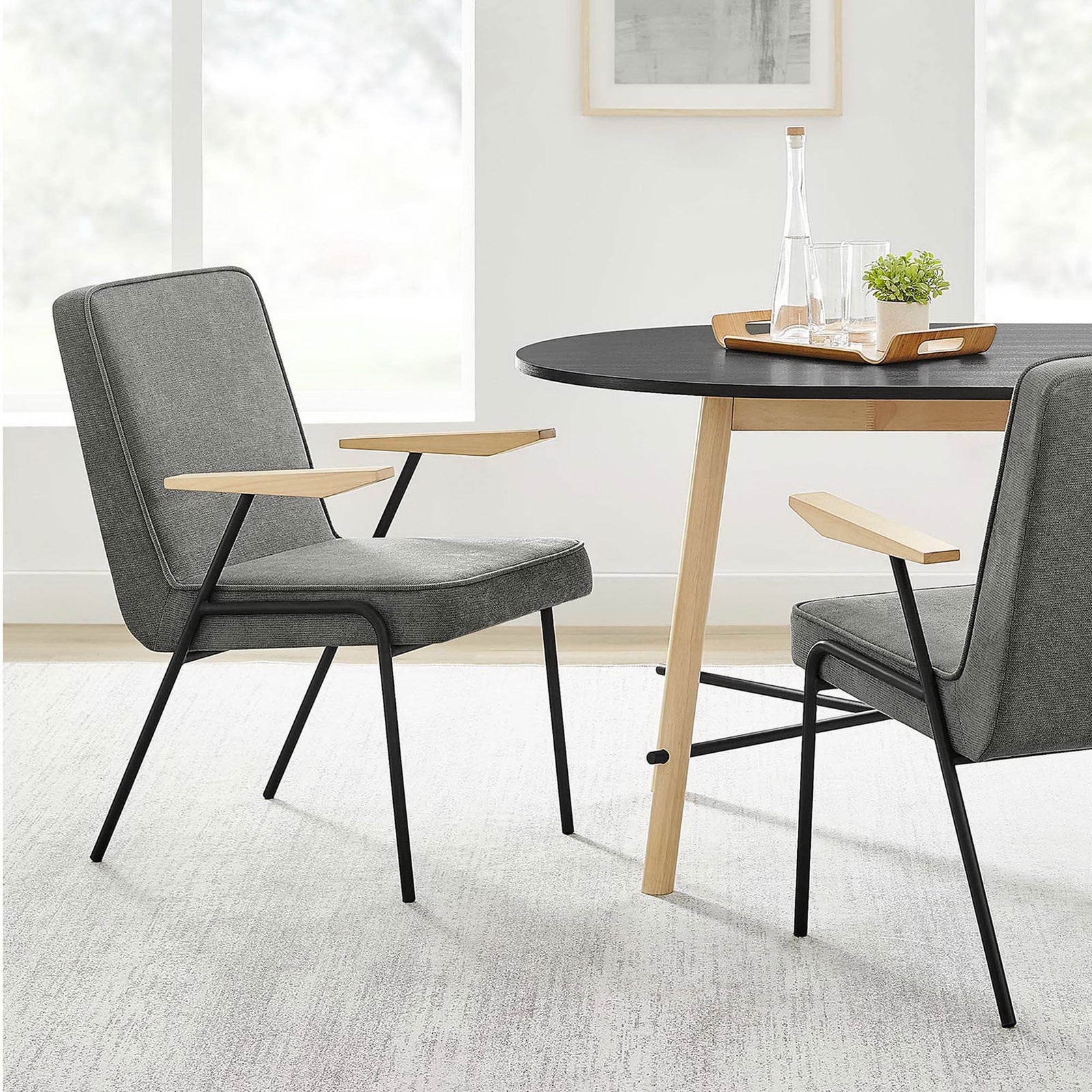 Slate dining armchairs paired with a round wood table create a clean, inviting modern dining nook. || EEI-6835-SLA || front_angle_room