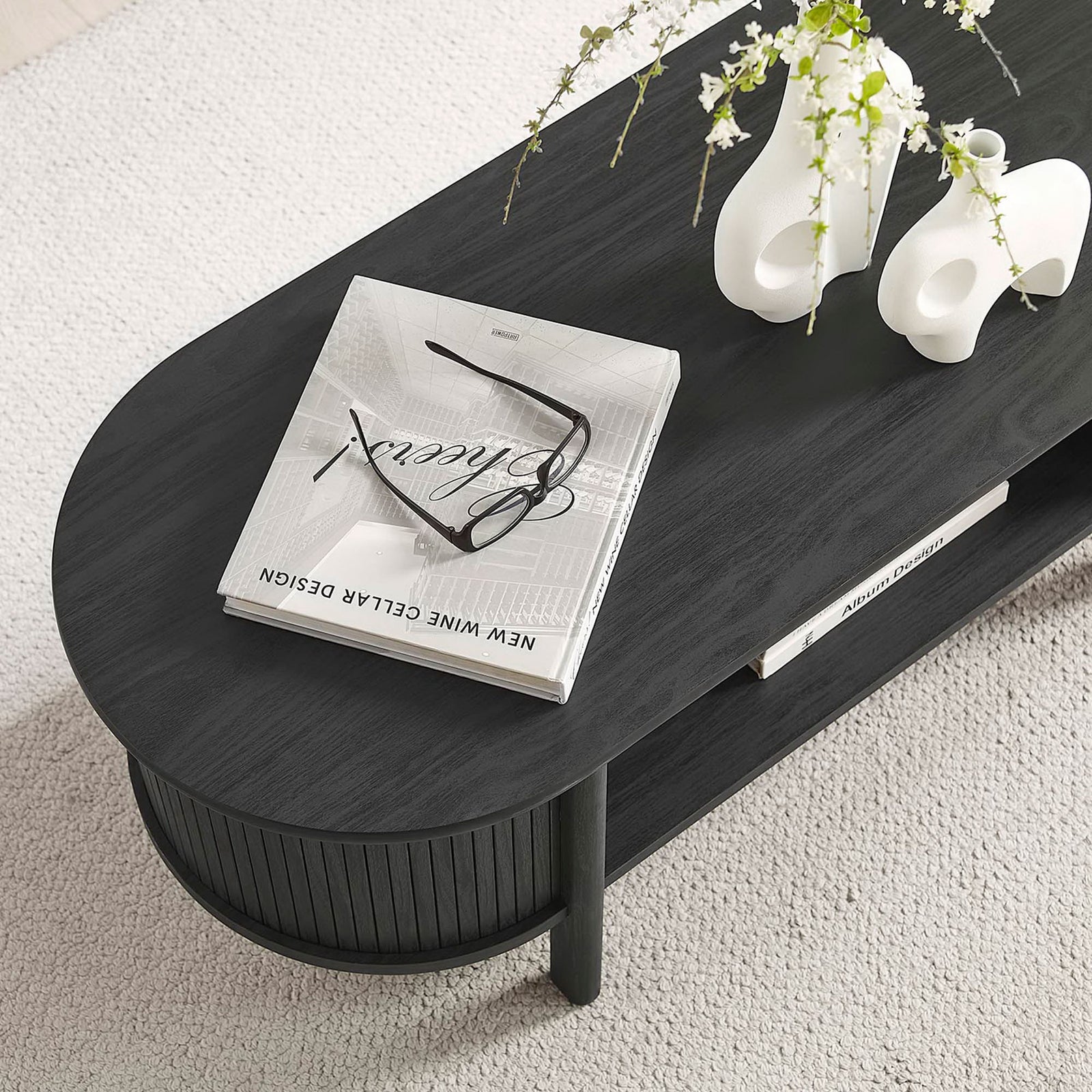 Top surface styled for daily use, with room for books and decor above the convenient open shelf. || EEI-6837-BLK || detail_room