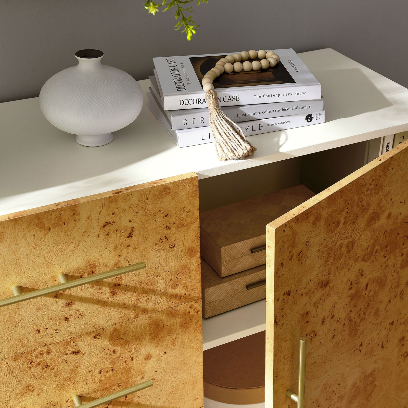 Styled burl wood cabinet with doors open to show roomy shelving and decor ready for display and storage || EEI-6848-WHI-BUR || storage_open_room