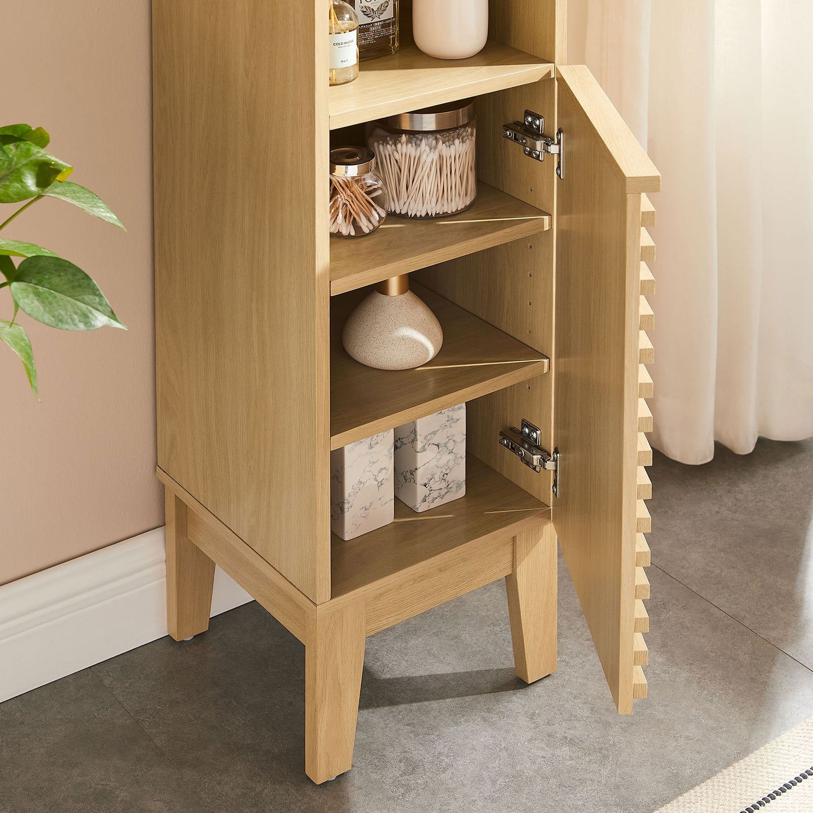Lower cabinet door opens to reveal adjustable shelves for flexible storage || EEI-6851-OAK || storage_open_room