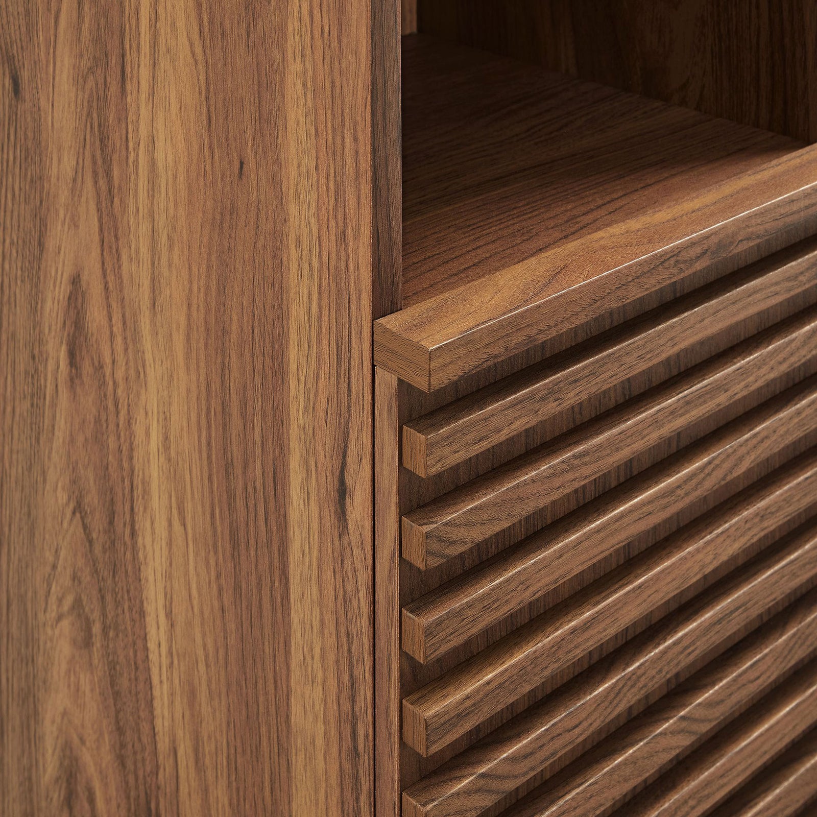 Textured slatted door design and smooth wood grain showcase the cabinet's modern craftsmanship || EEI-6851-WAL || detail_studio