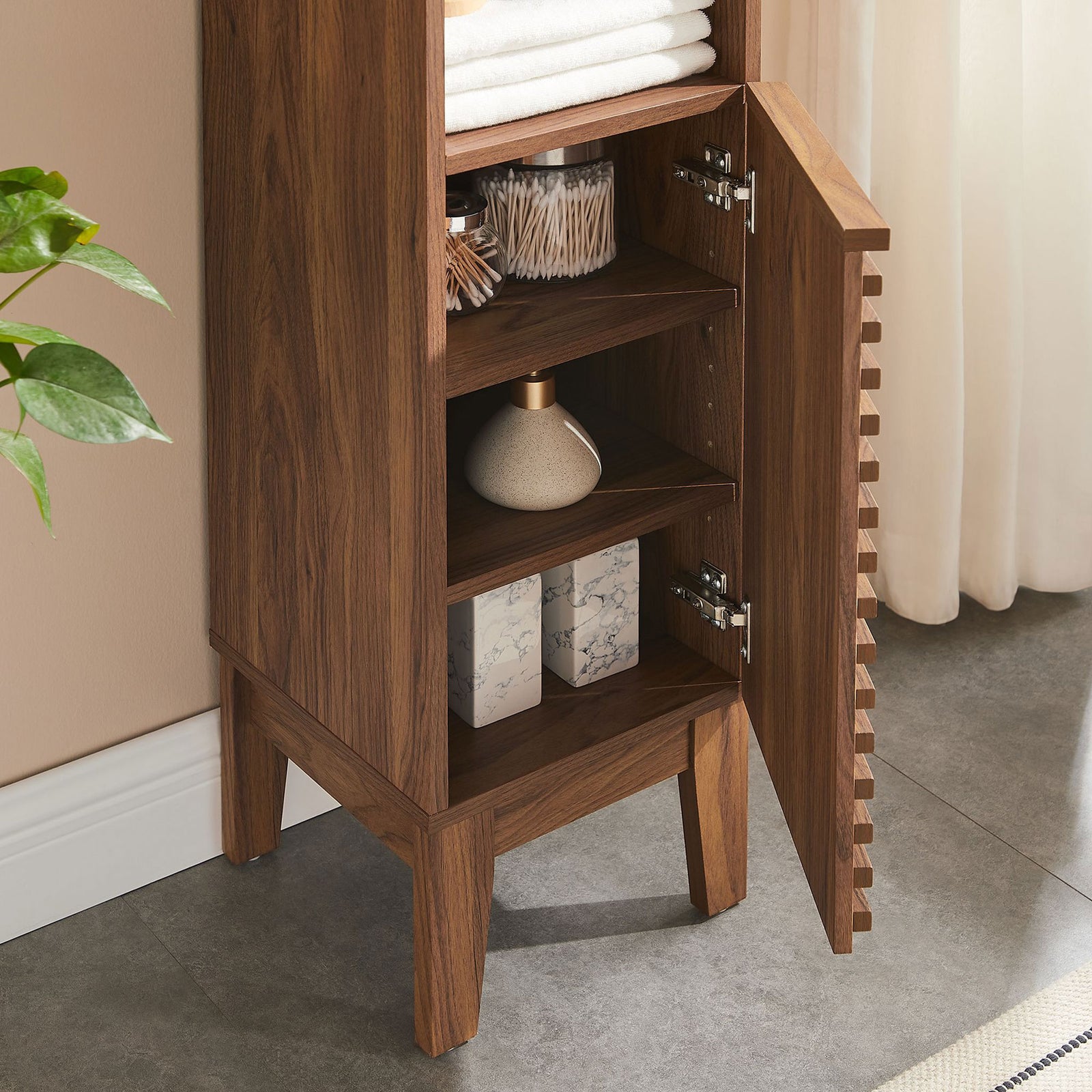 Interior shelves keep toiletries organized behind slatted doors with quiet, soft-close hinges || EEI-6851-WAL || storage_open_room