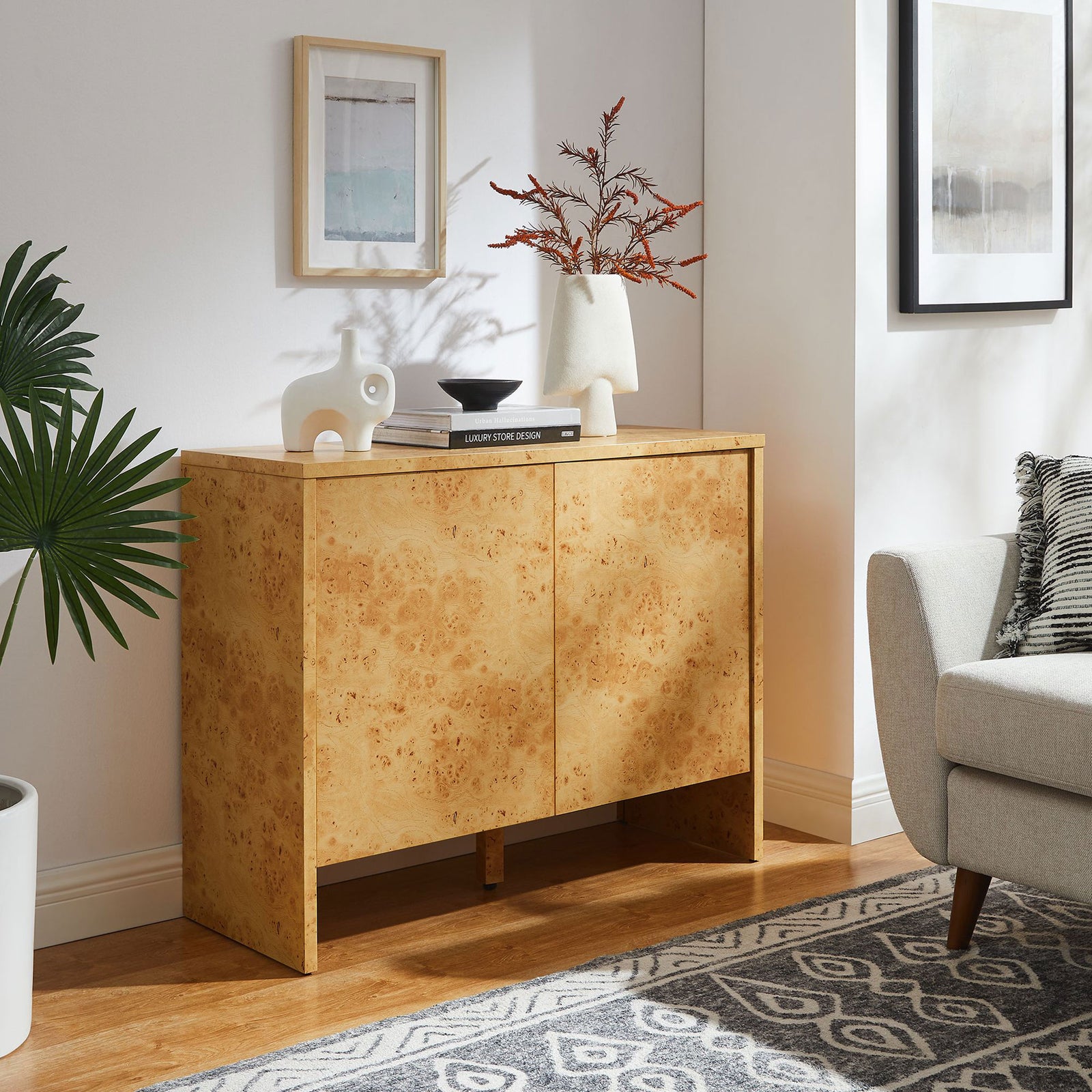 Hudson burl wood sideboard styled in a cozy living space, offering warm texture and concealed storage. || EEI-6859-BUR || front_angle_room