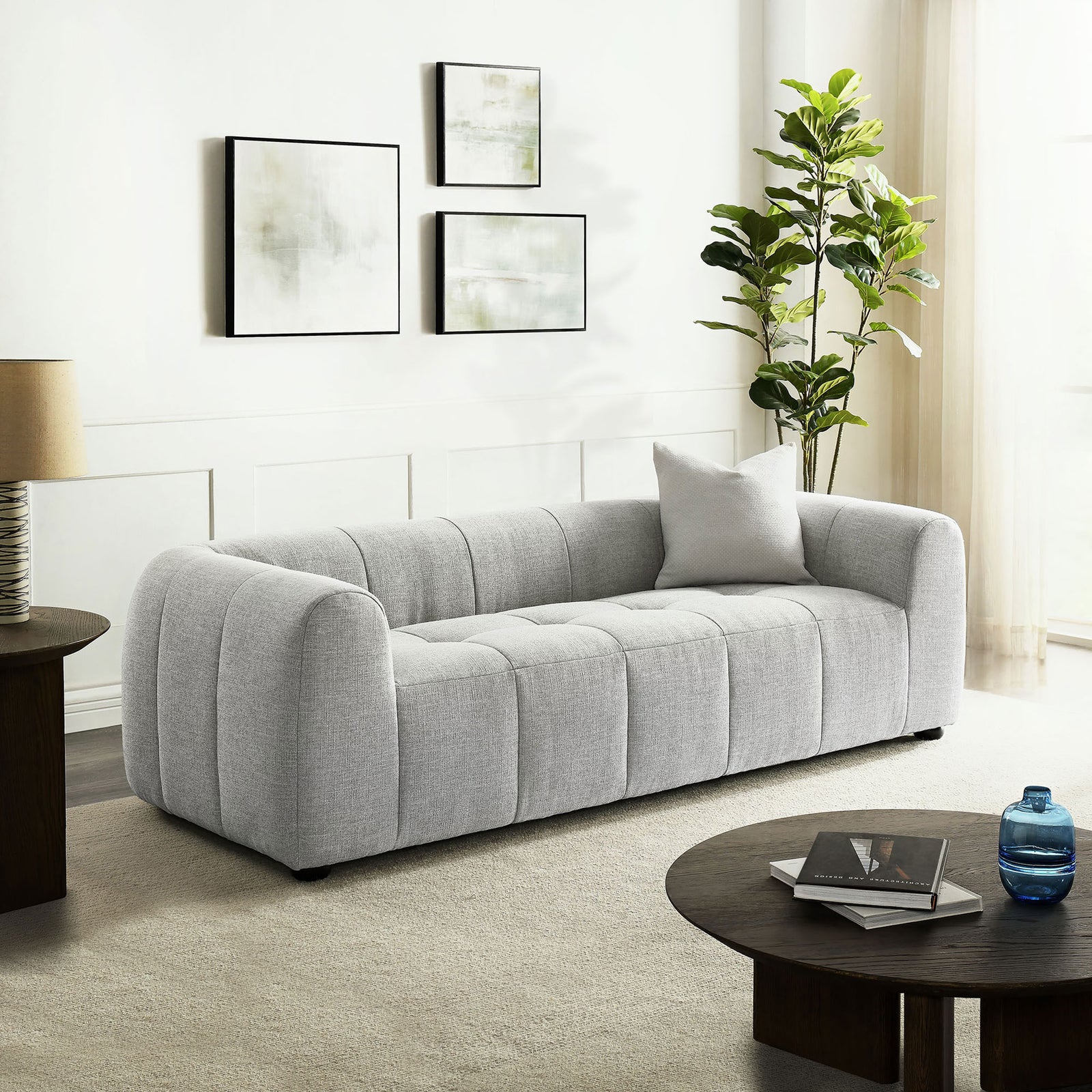 Pewter Liana sofa styled in a bright living room with modern decor, highlighting its deep seating and relaxed silhouette || EEI-6866-PEW || front_angle_room