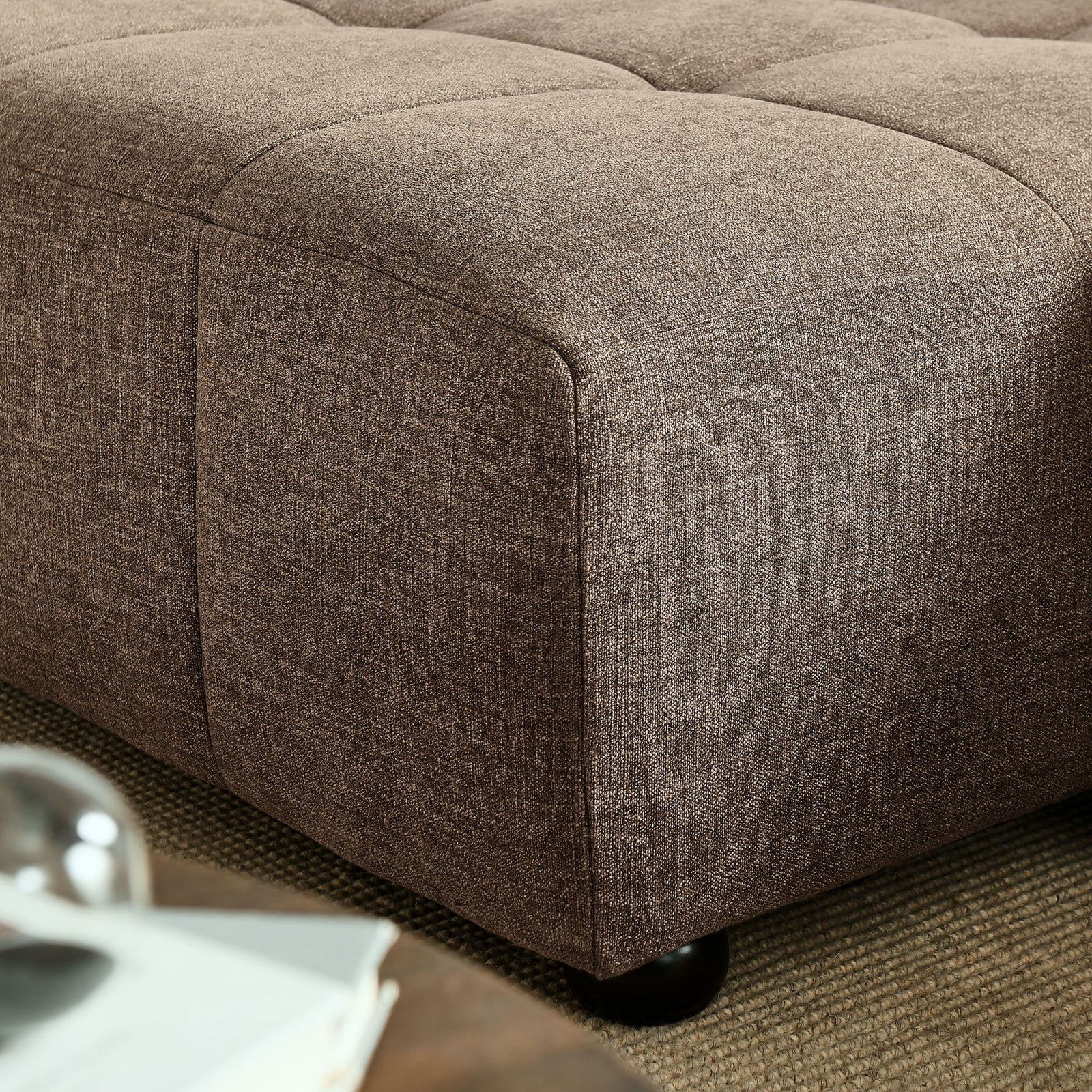 Mocha fabric corner of the Liana chaise shows soft woven texture and tailored tufted upholstery || EEI-6868-MOC || detail_room
