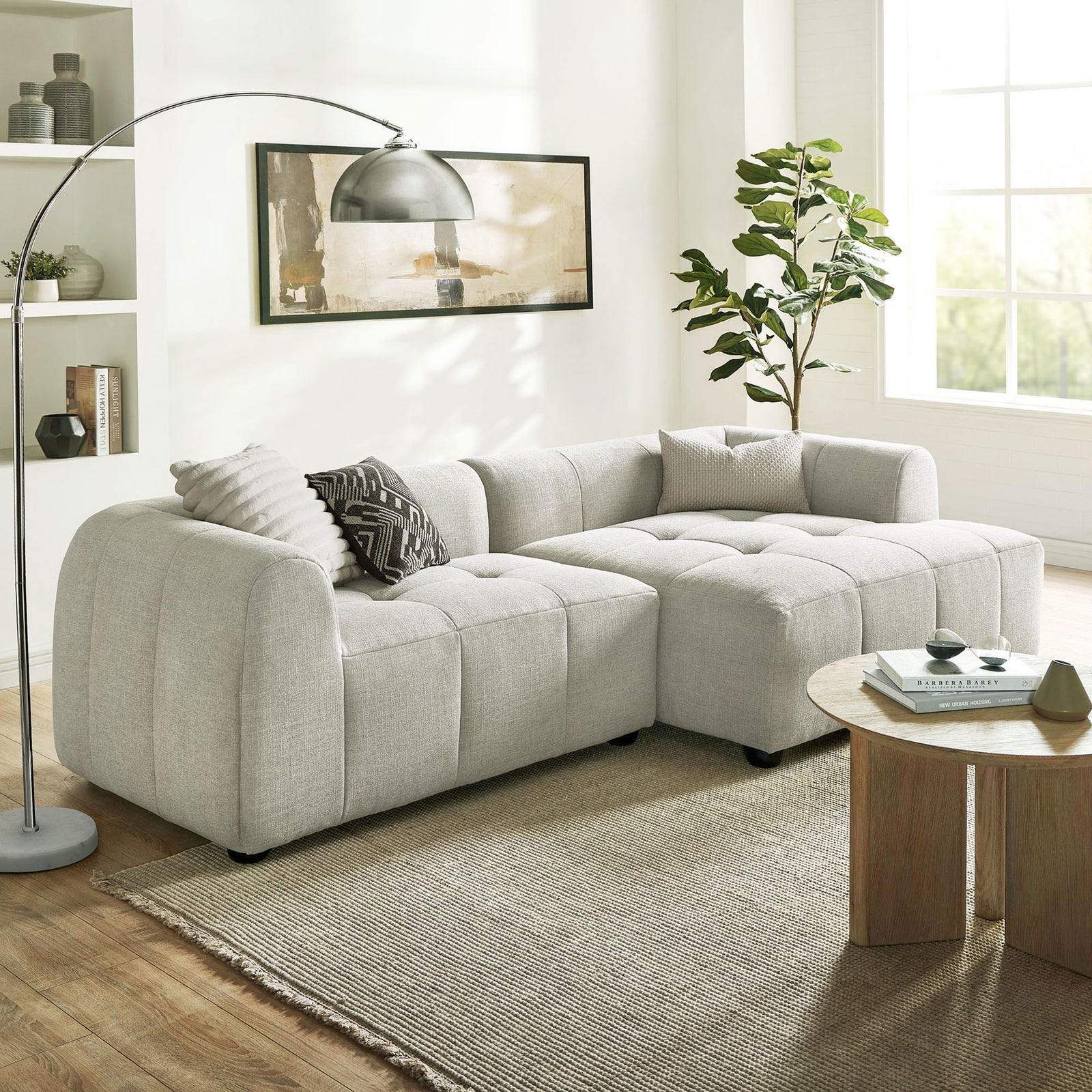 Right-facing linen modular sofa with chaise arranged in a cozy living room with rug, table, and lamp || EEI-6869-LIN || front_angle_room