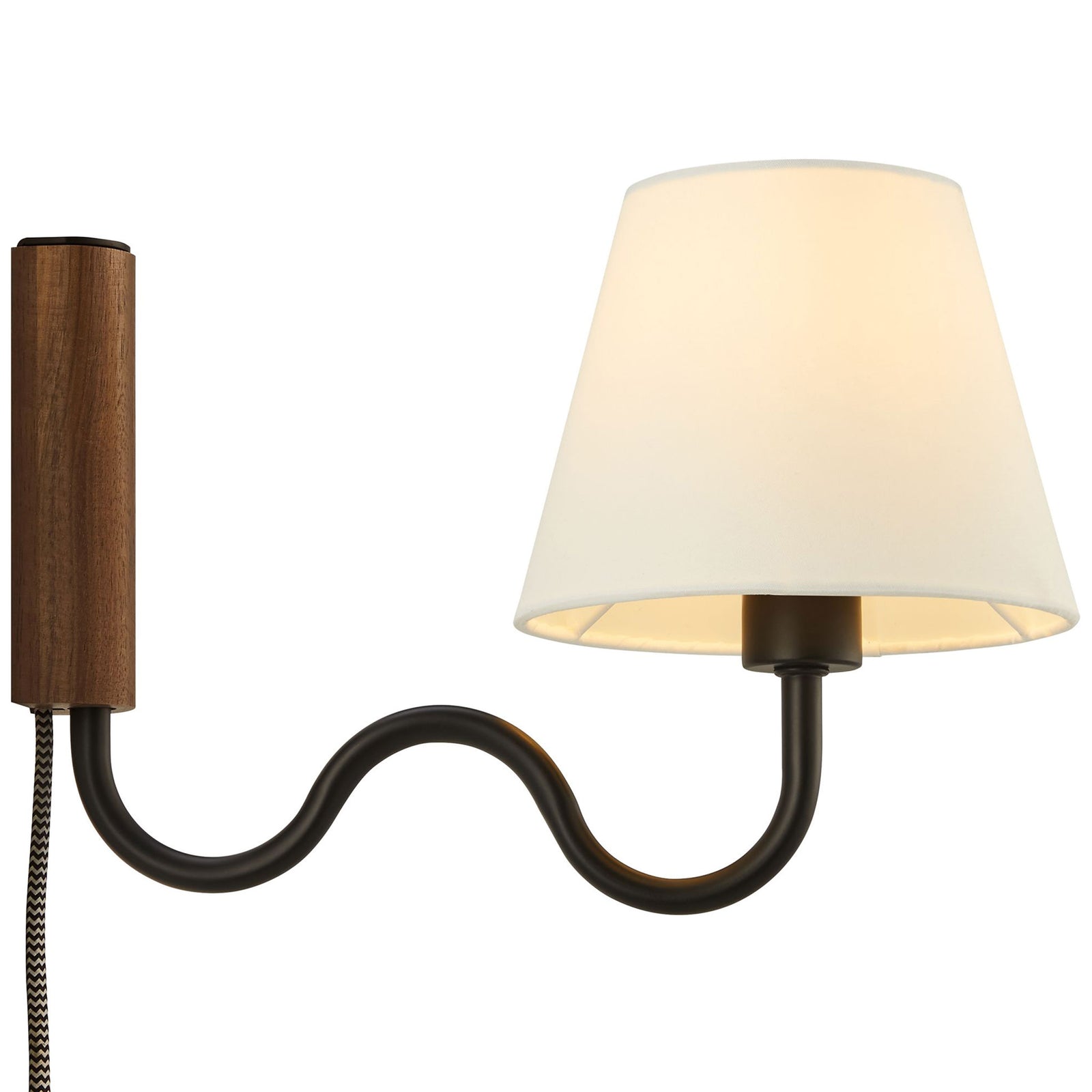 Wall sconce with glowing white fabric shade, walnut backplate, and black squiggle arm for cozy ambiance || EEI-6881-WAL-BLK || side_on_studio