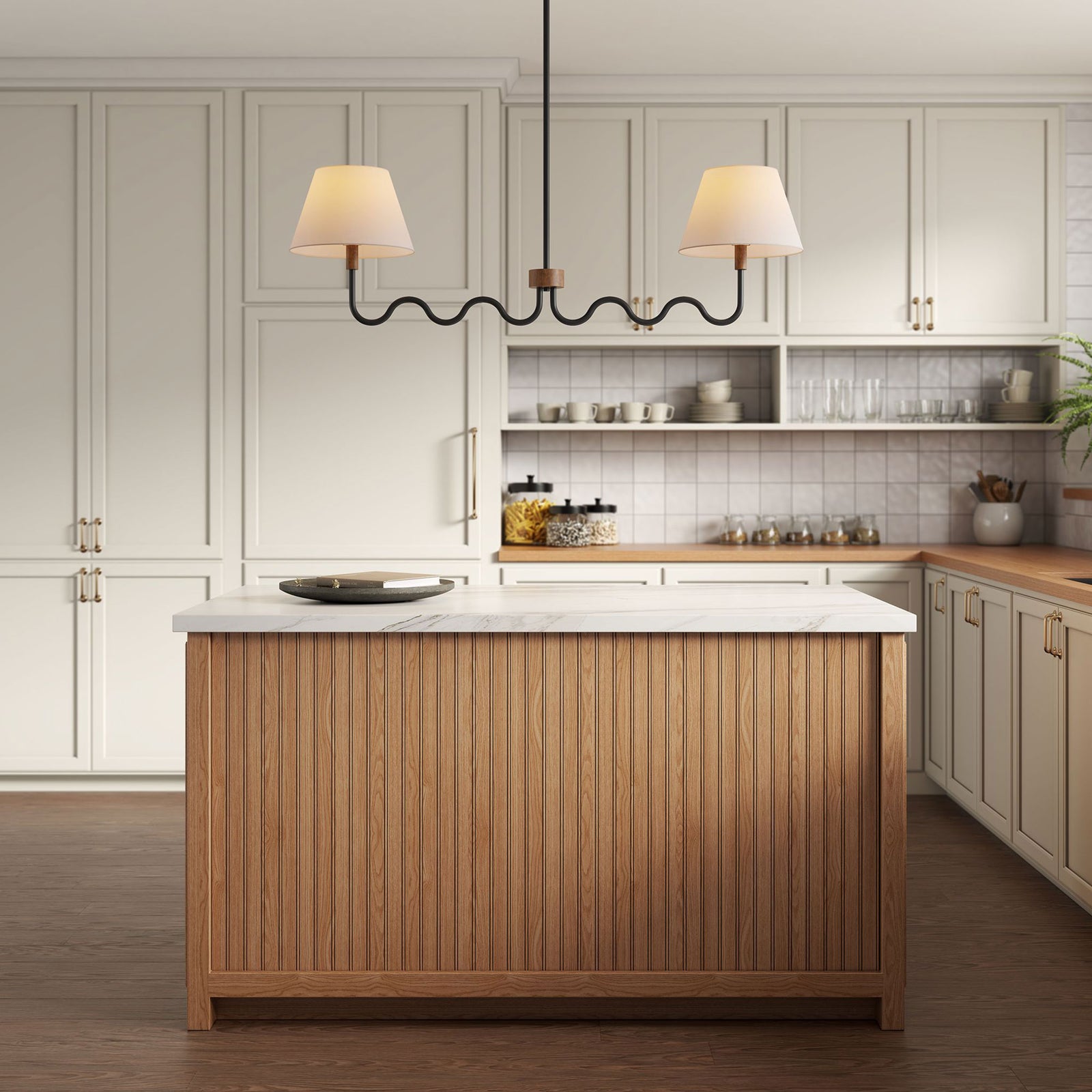 Warm ambient light over a kitchen island from the twin-shade squiggle pendant in black and walnut || EEI-6882-WAL-BLK || front_on_room