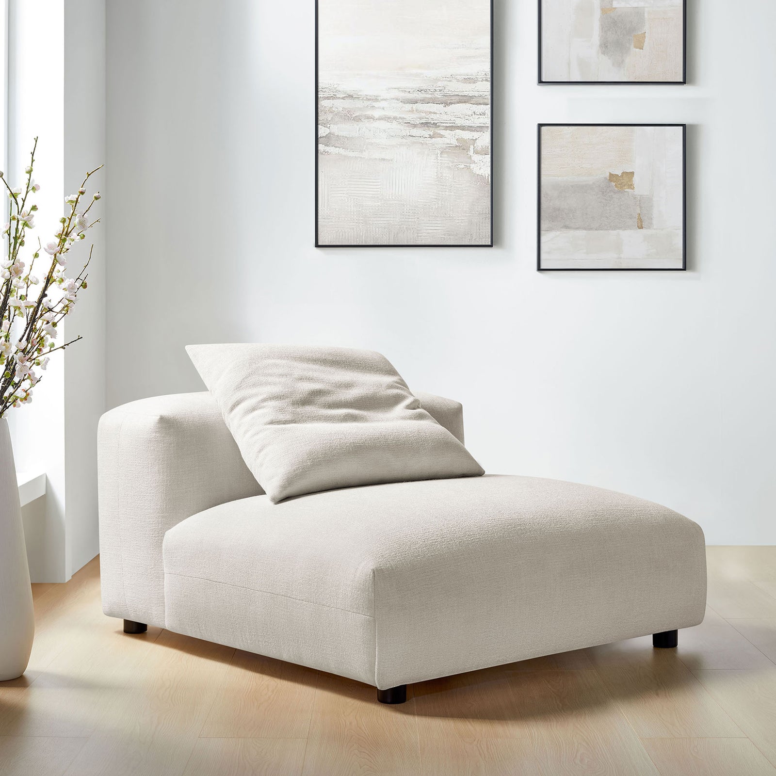 Cozy armless lounge chair adds a soft, neutral statement with its textured upholstery and plush pillow. || EEI-6885-SAL || front_angle_room